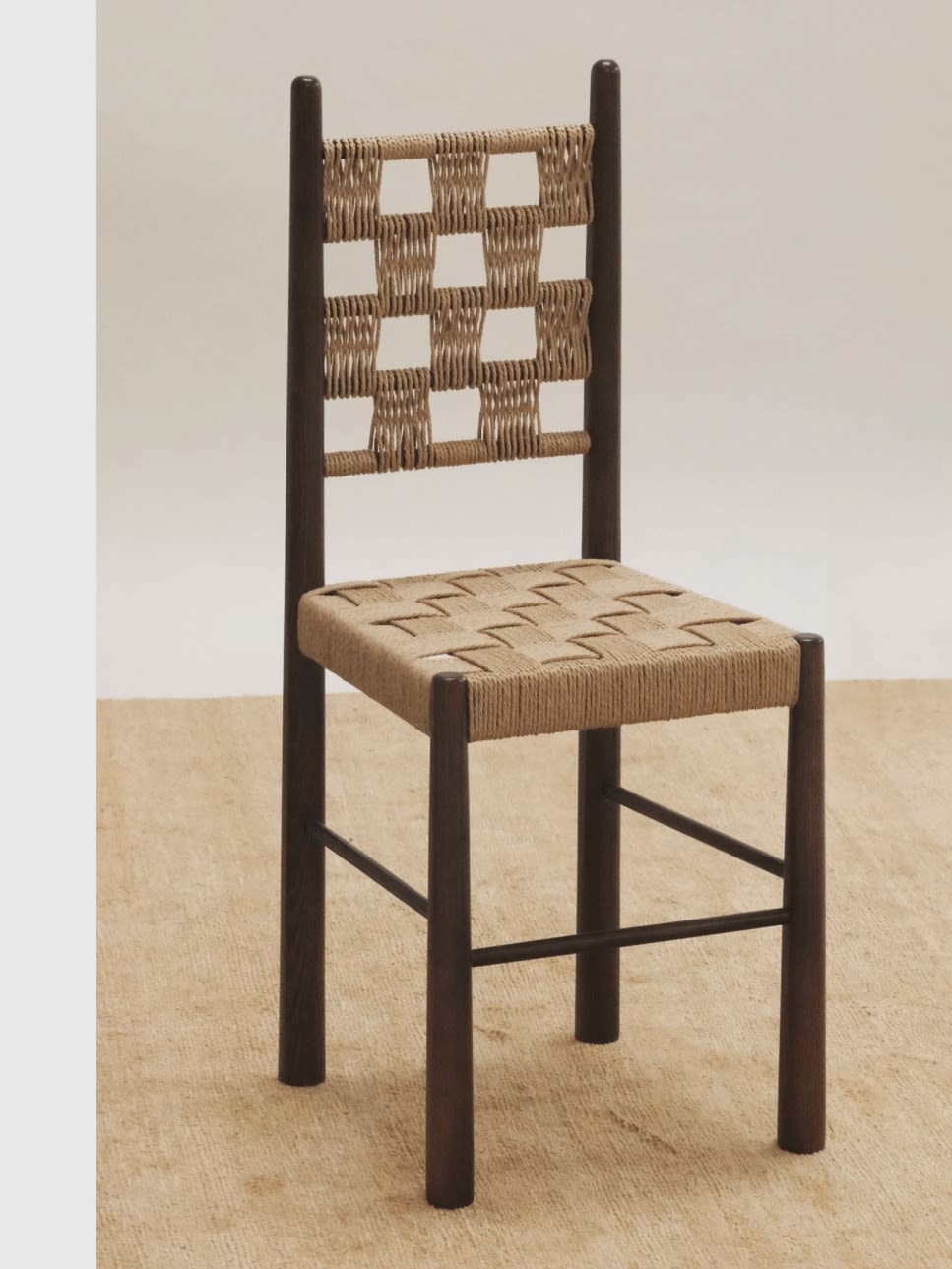 Check Accent Chair — angled view with woven seat in neutral setting