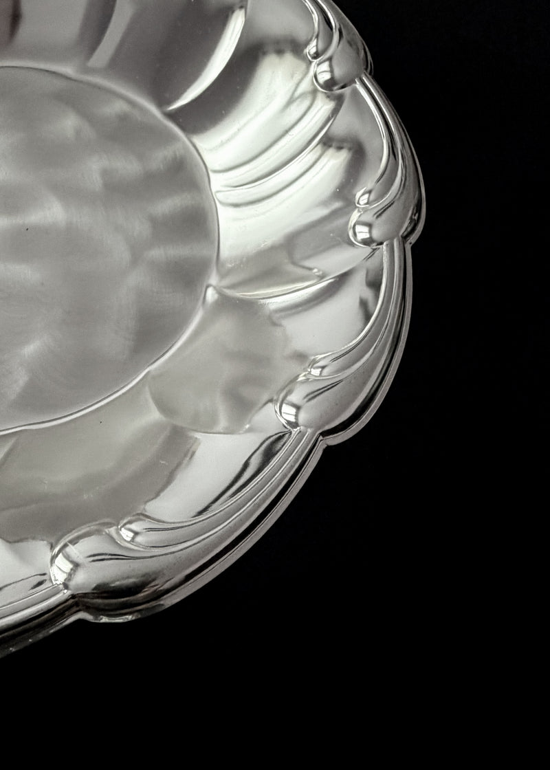 Vintage Dish in Metal — close-up of polished silver surface