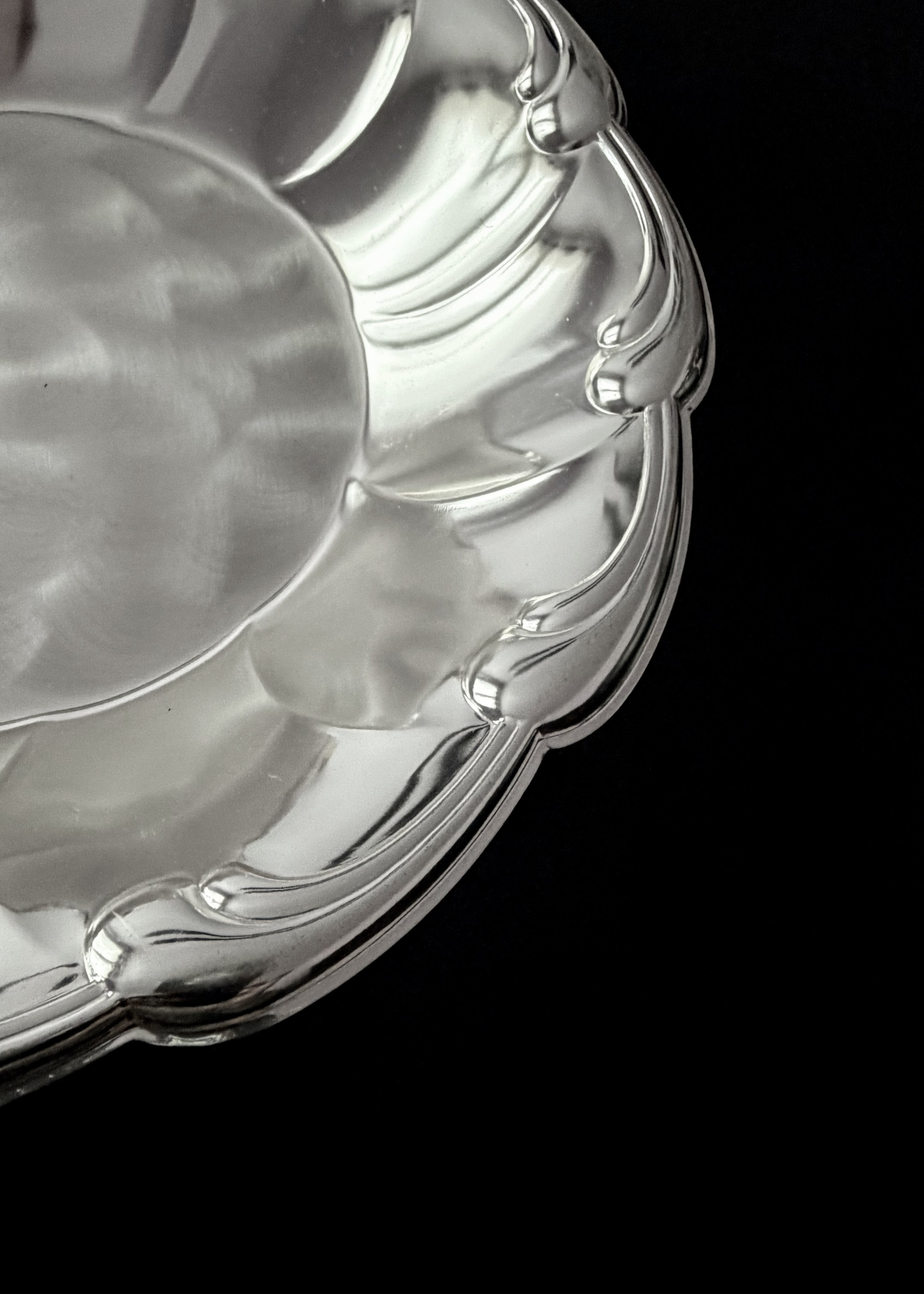 Vintage Dish in Metal — close-up of polished silver surface