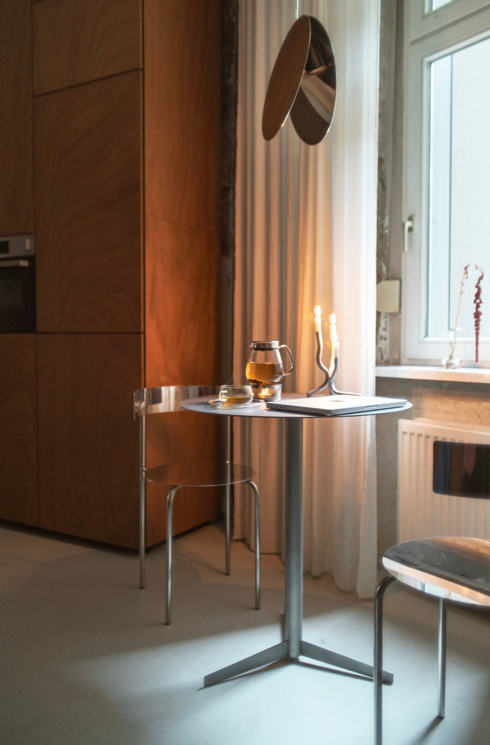Table - Isla x Paul Delrez - Stainless Steel — side angle in modern kitchen setting