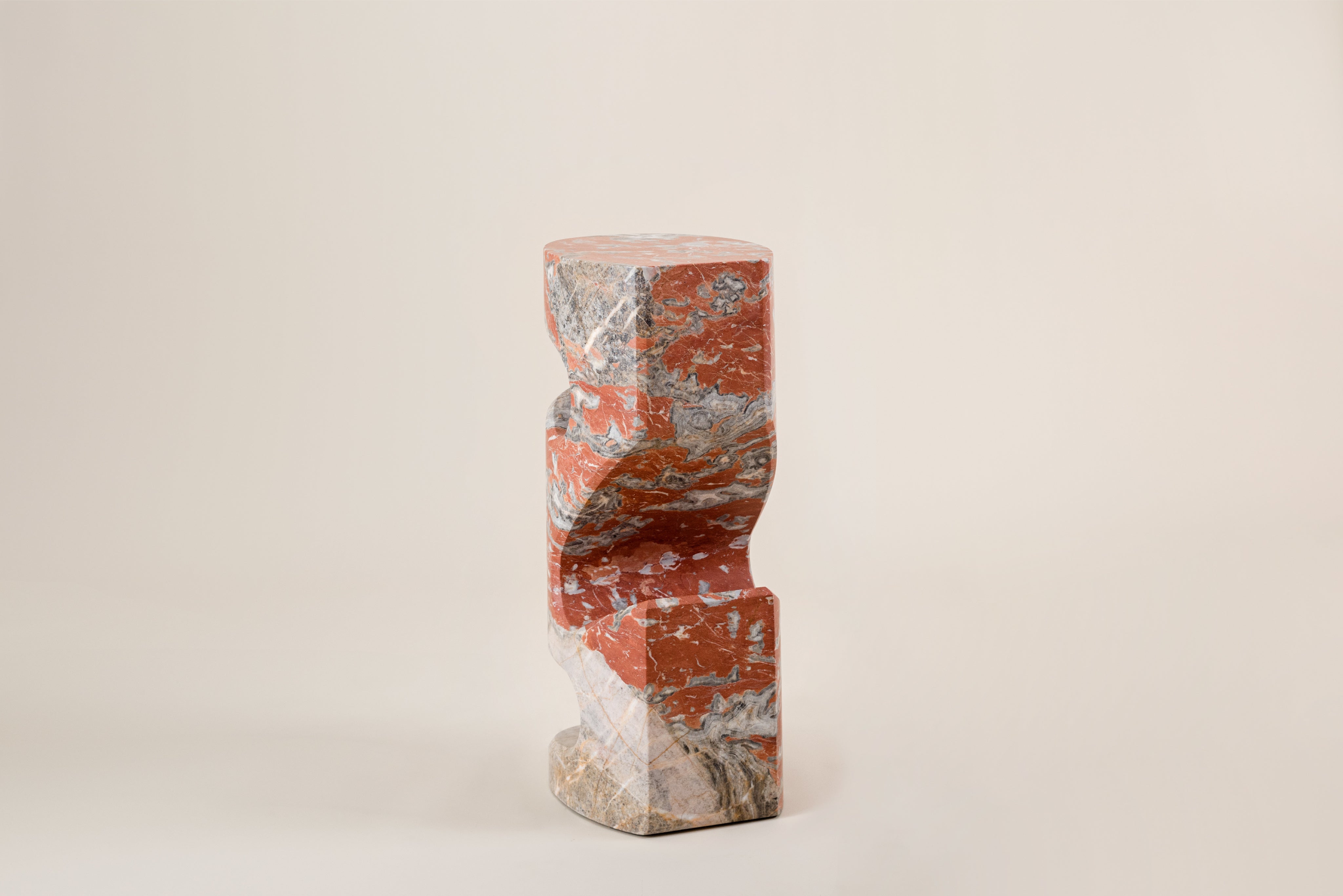 Tobo Side Table — angled view of red marble design