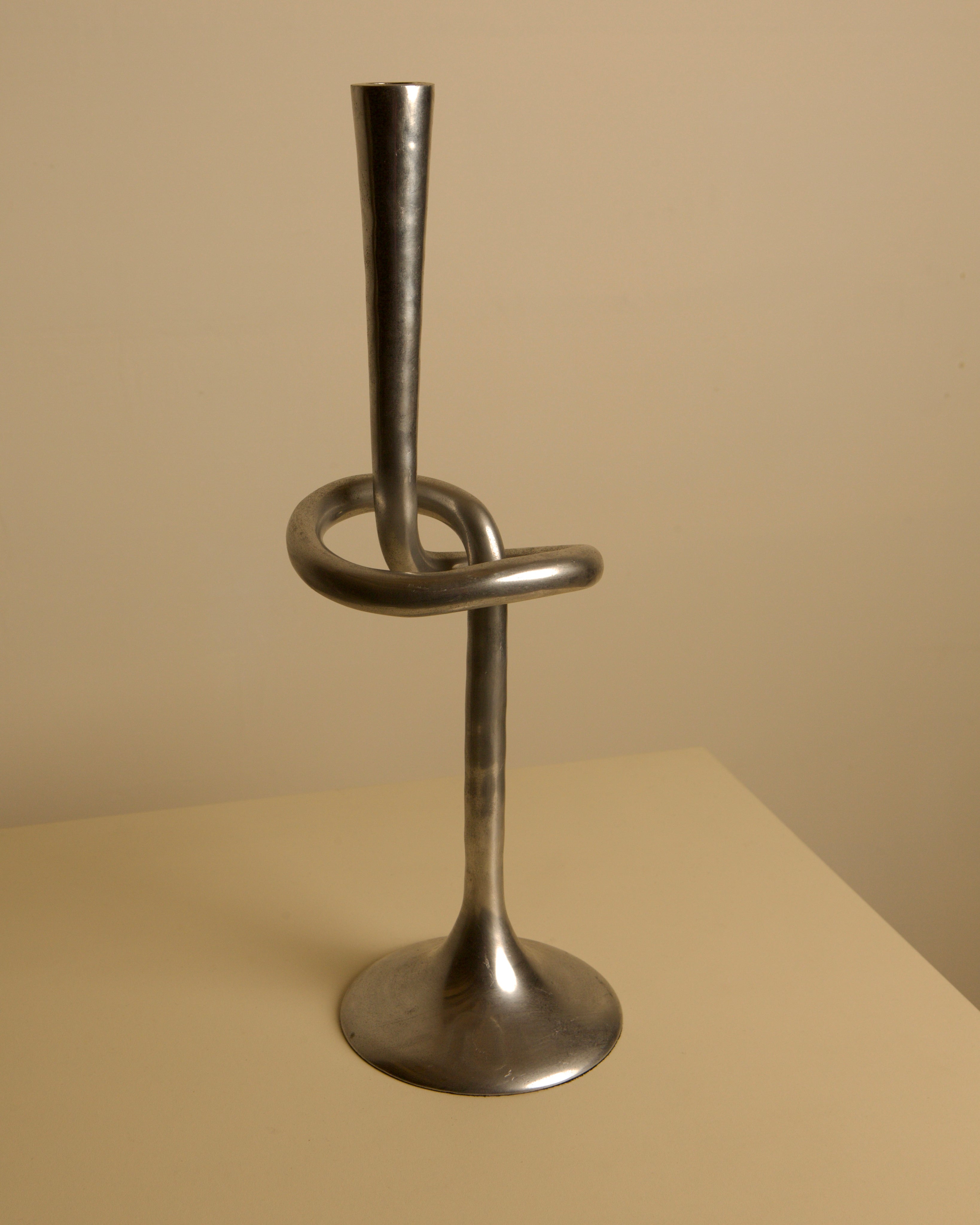 80s Aluminum "Knot" Candleholder — close-up of metallic surface and design