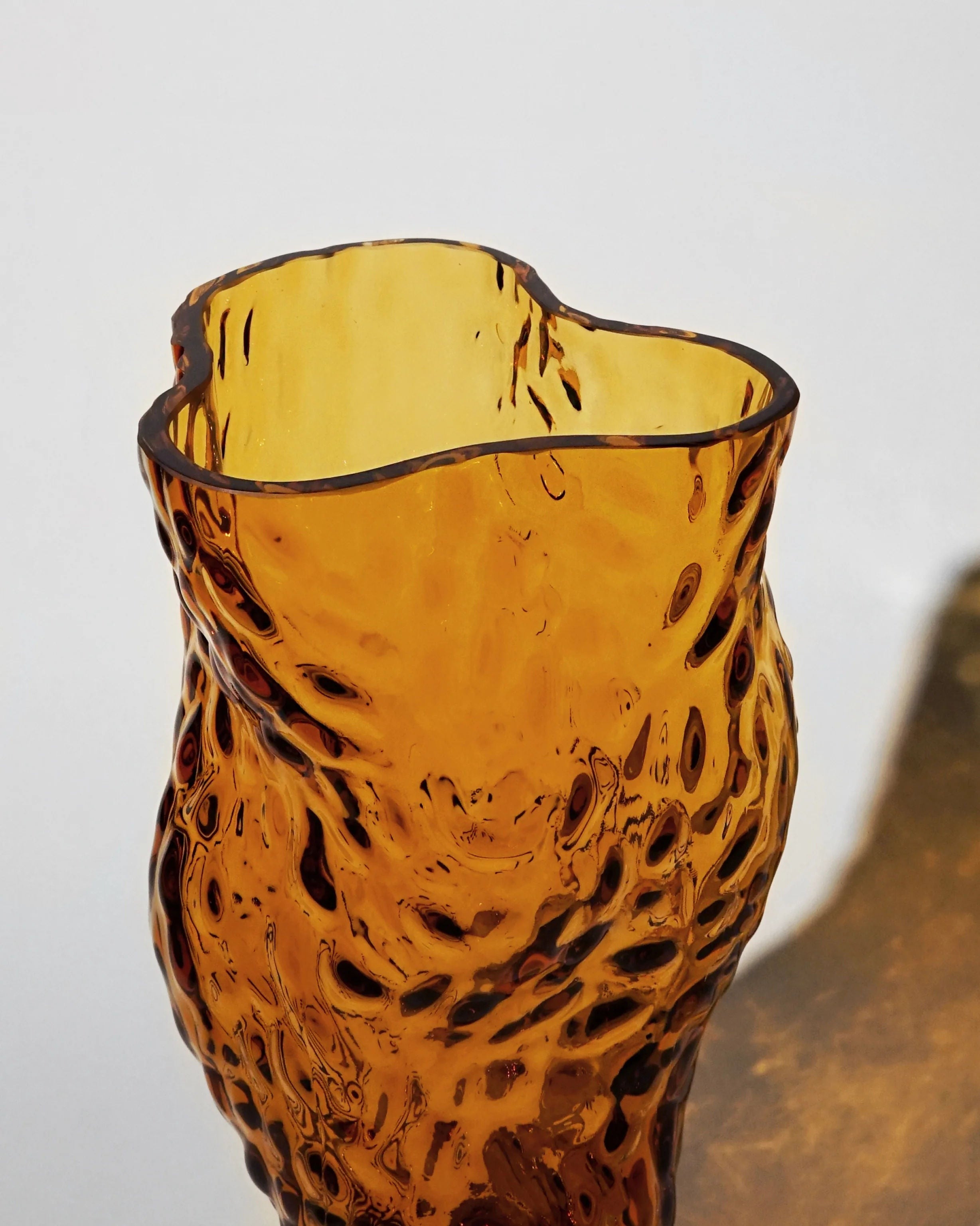 Ostrea Rock Glass Vase - Amber — side angle highlighting textured amber glass