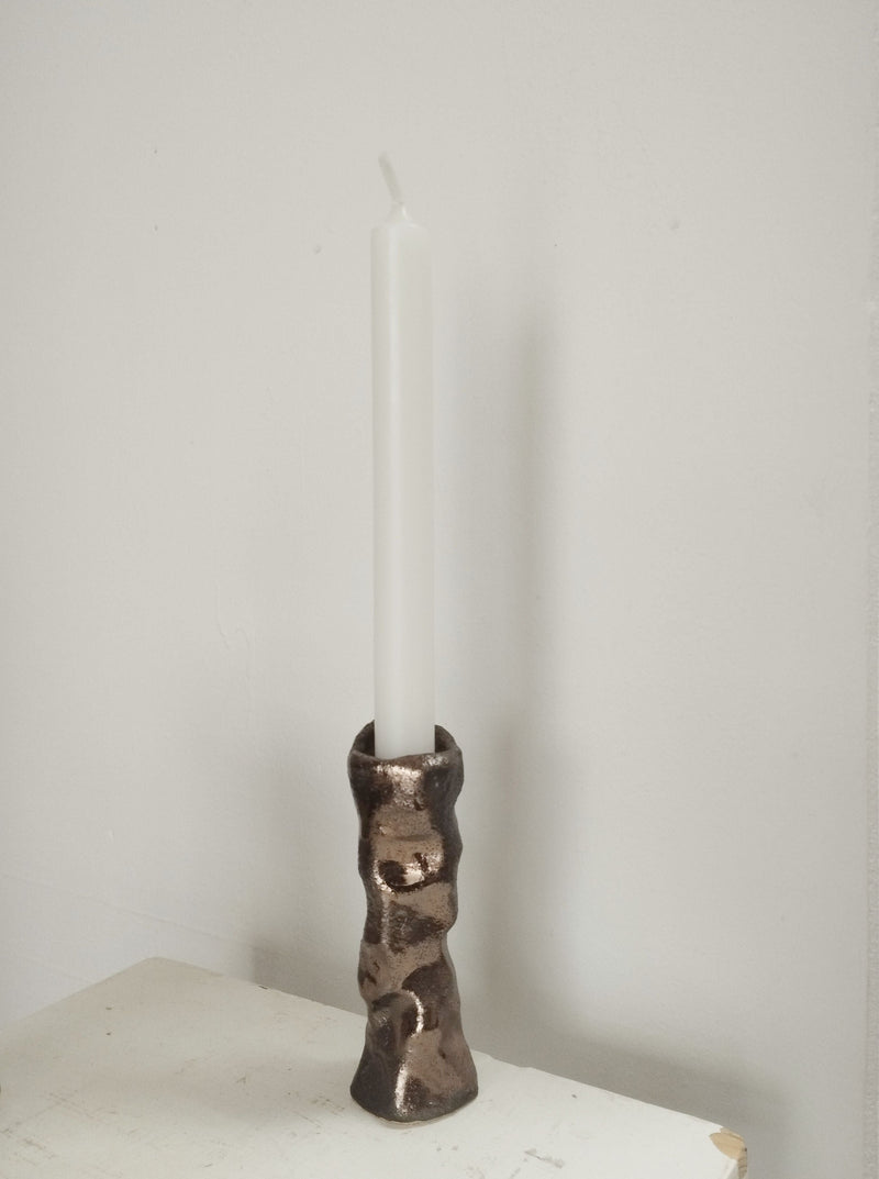 Bronze enamel sandstone candleholder with white taper candle