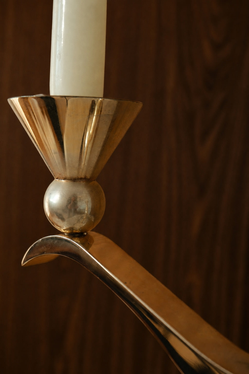 A Sculptural Silver- and Gold-Patinated Metal Candle Holder — side angle