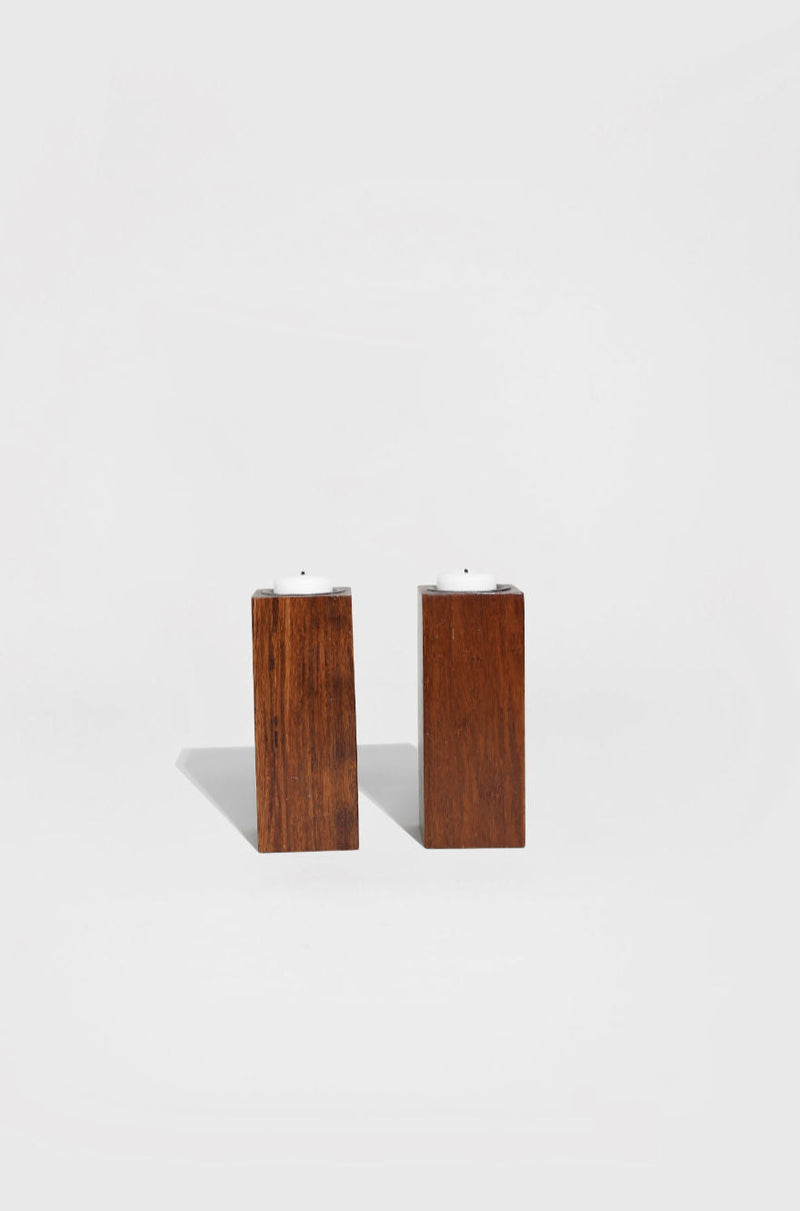 Two rectangular walnut wood block candleholders with metal inserts