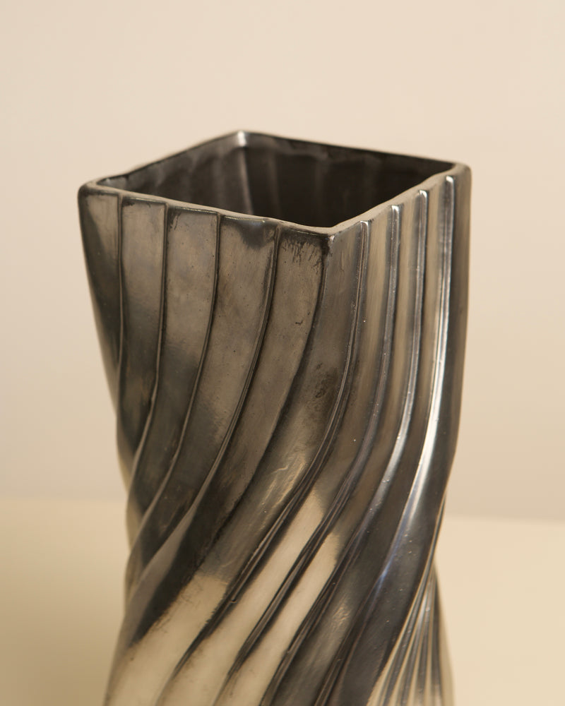 Twisted ceramic vase with dark metallic finish, 80s design detail