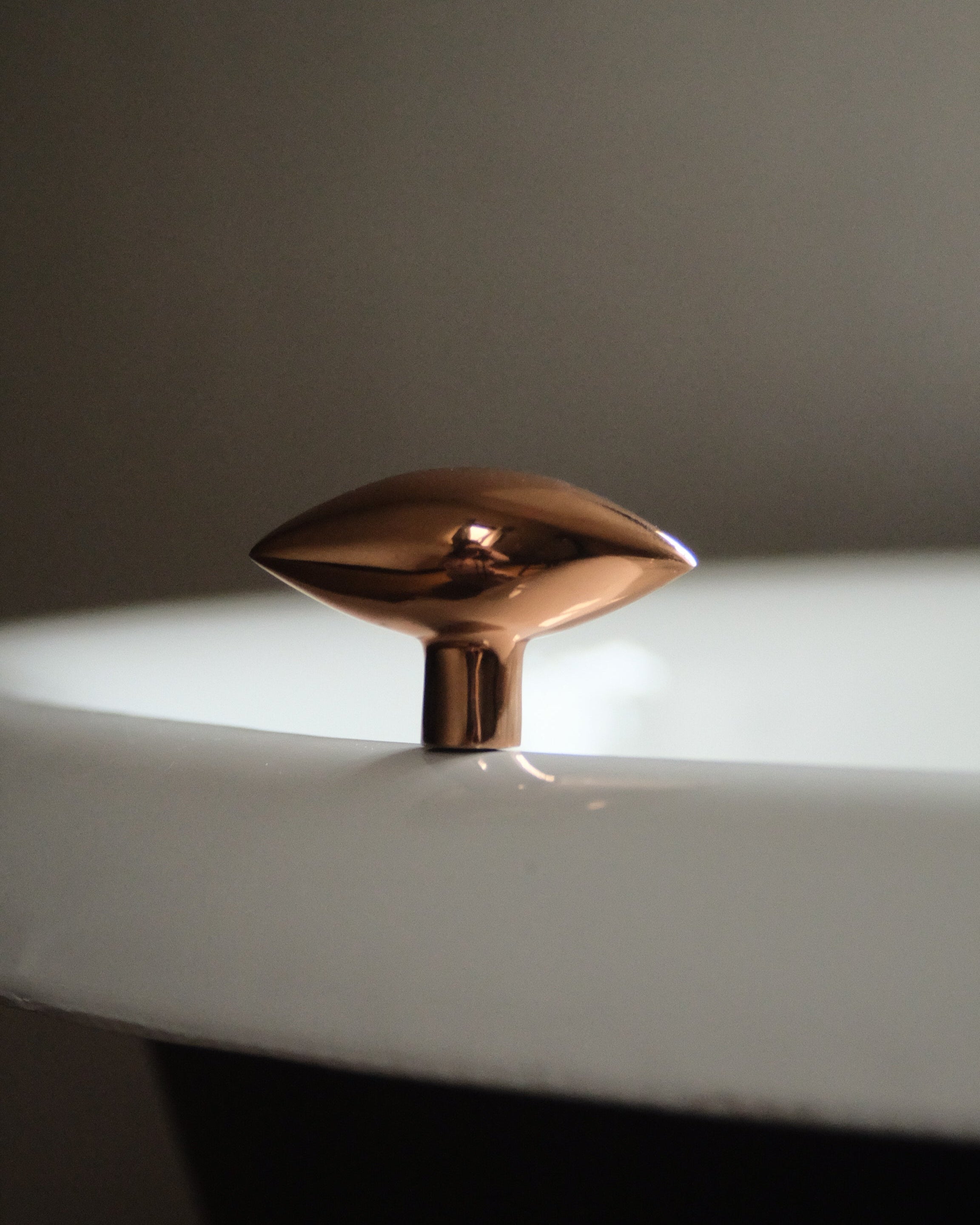 GOOD EYE Cabinet Knob/Wall Hook — close-up of polished copper finish