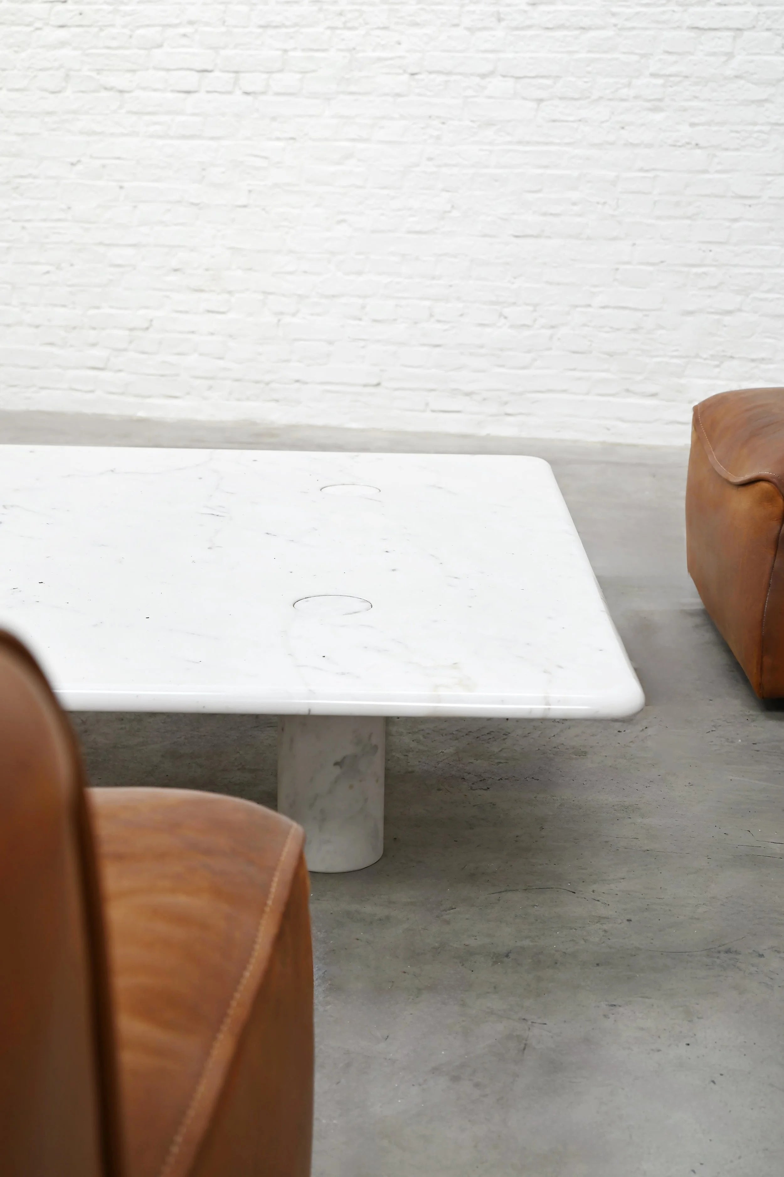 Angelo Mangiarotti Carrara Marble Coffee Table, Italy 1970's — back view with brown leather chairs