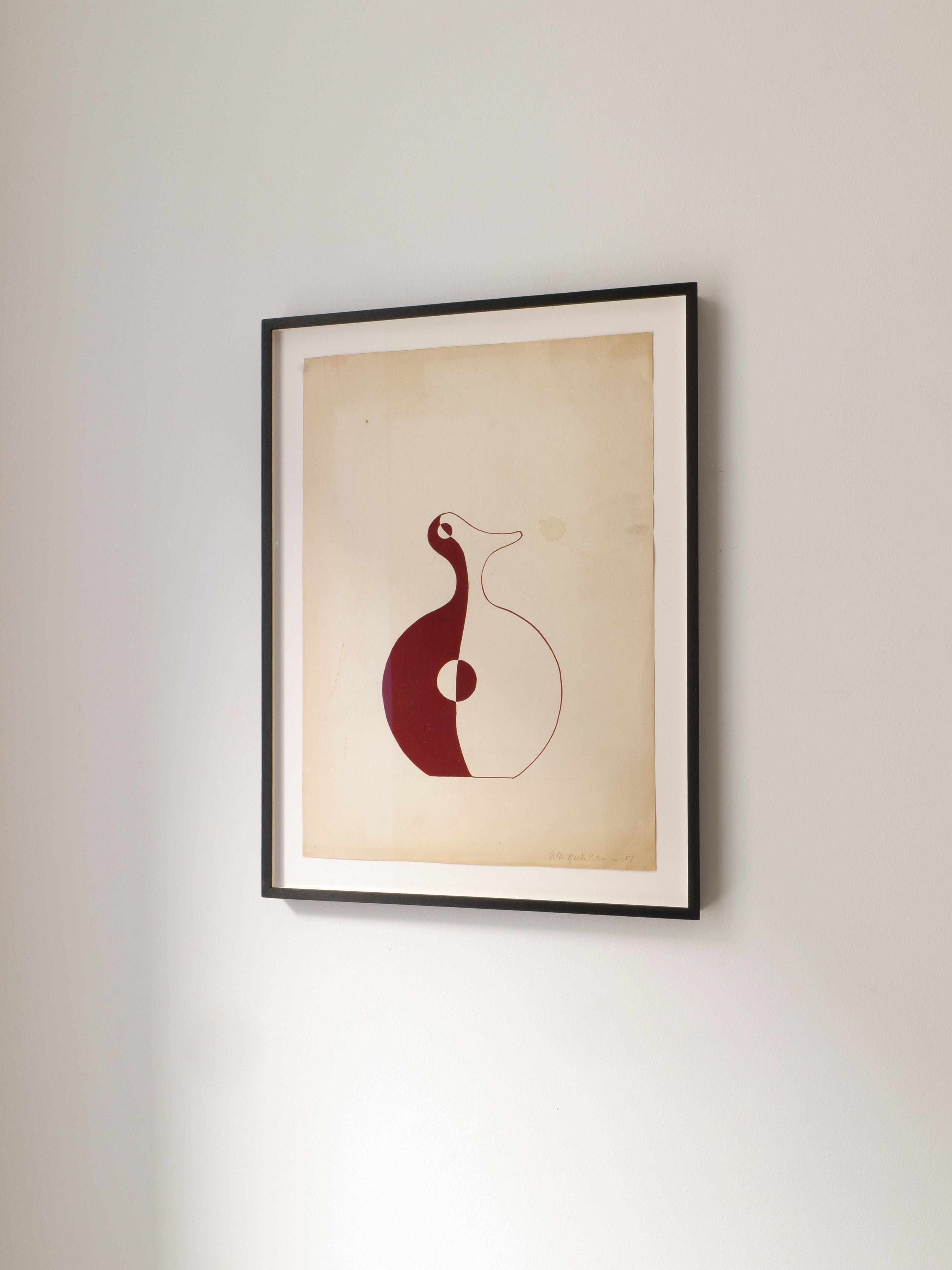‘Red Vase’ Painting 1951 by Collection apart, a framed abstract artwork with maroon and white shapes, inspired by Danish surrealism, hangs on a plain white wall for a minimalist, modern look.