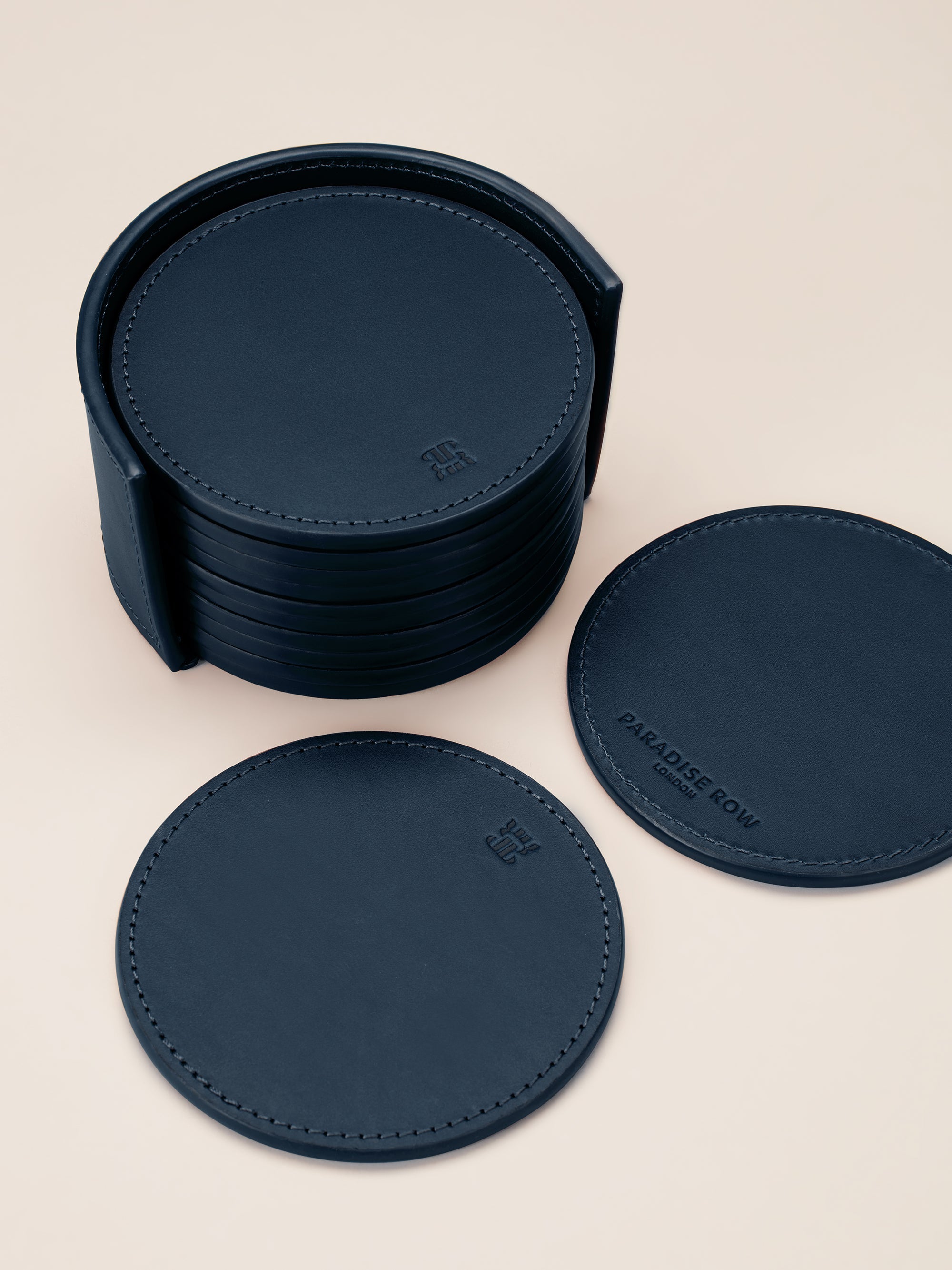 Leather Coasters in Holder (set of 12) — top view of navy leather coasters