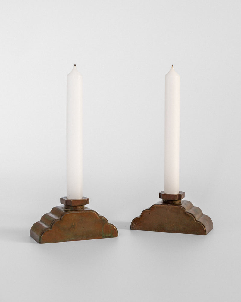 Pair of bronze Art Deco candleholders with white candles, Sweden 1930s