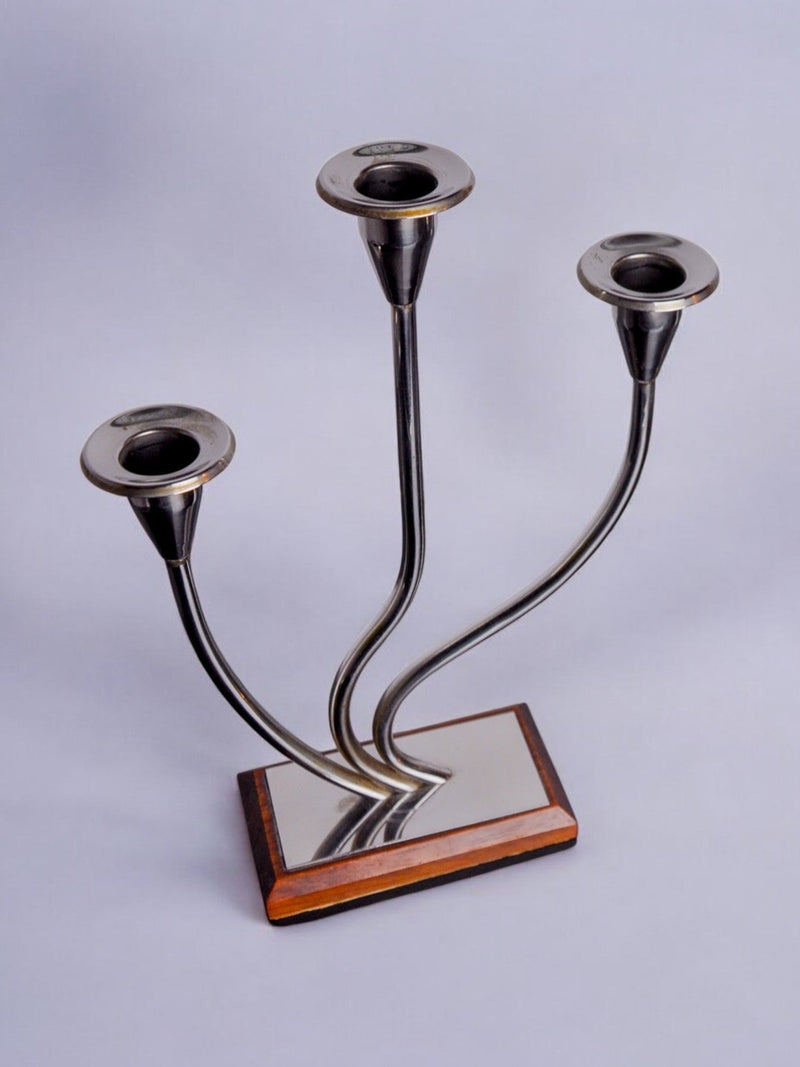Art deco Candleholder, Spain, 1970 — close-up of polished metal and wood base