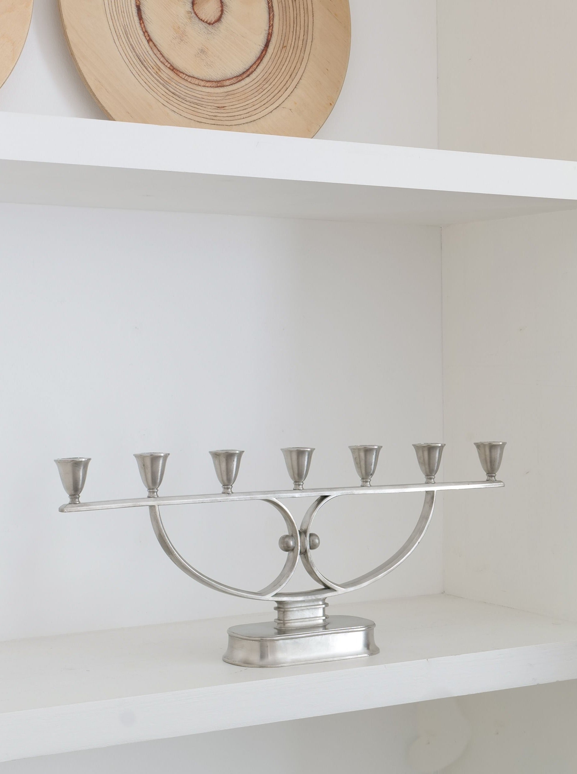 Just Andersen Candelabra 1930s — close-up of polished silver metal on shelf