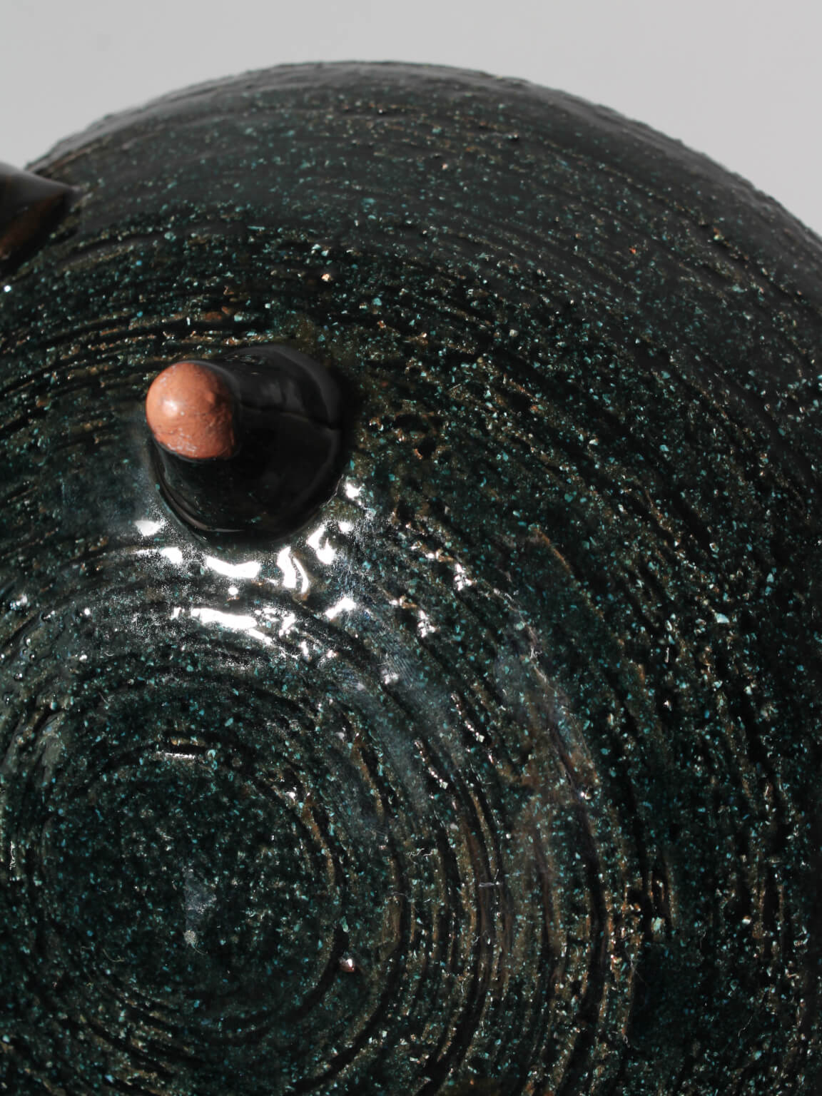 Eke Bjerén Swedish Ceramic Bowl On Legs — close-up of dark green ceramic texture