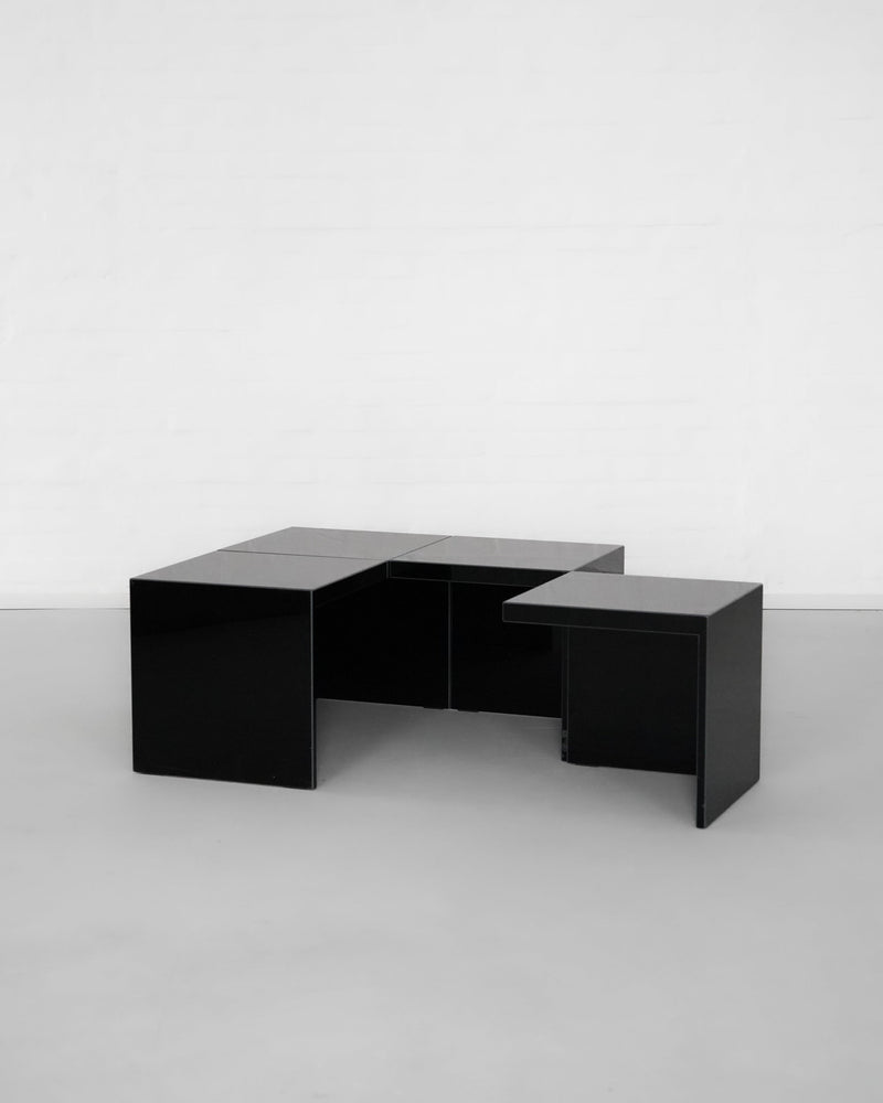 Black geometric modular side tables with interlocking design