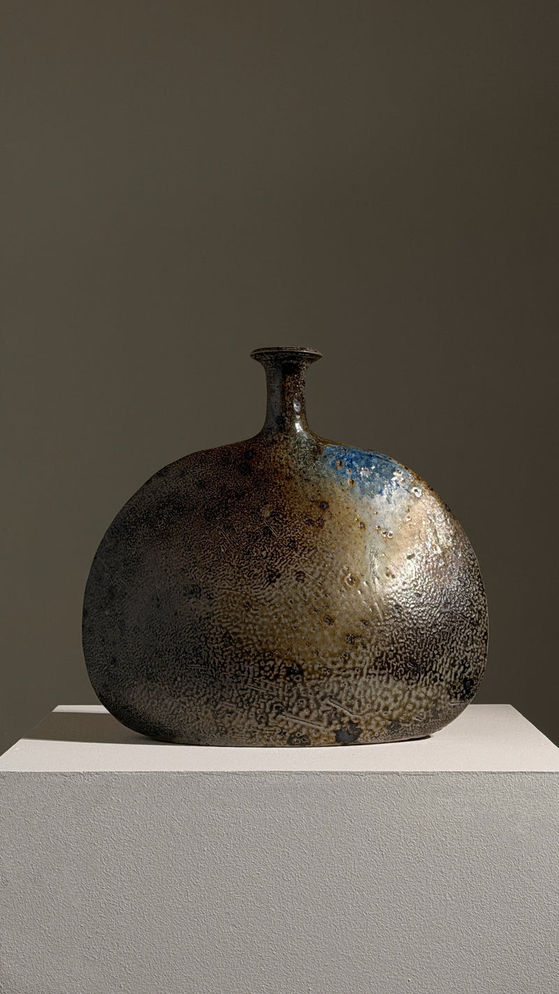 Large bottle vase by Gustave Tiffoche — close-up of ceramic texture