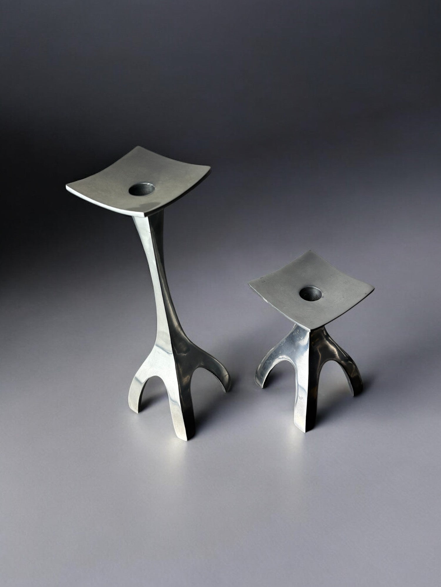 Pair of Biomorphic candleholders, solid aluminum, Spain, 1970's — side angle