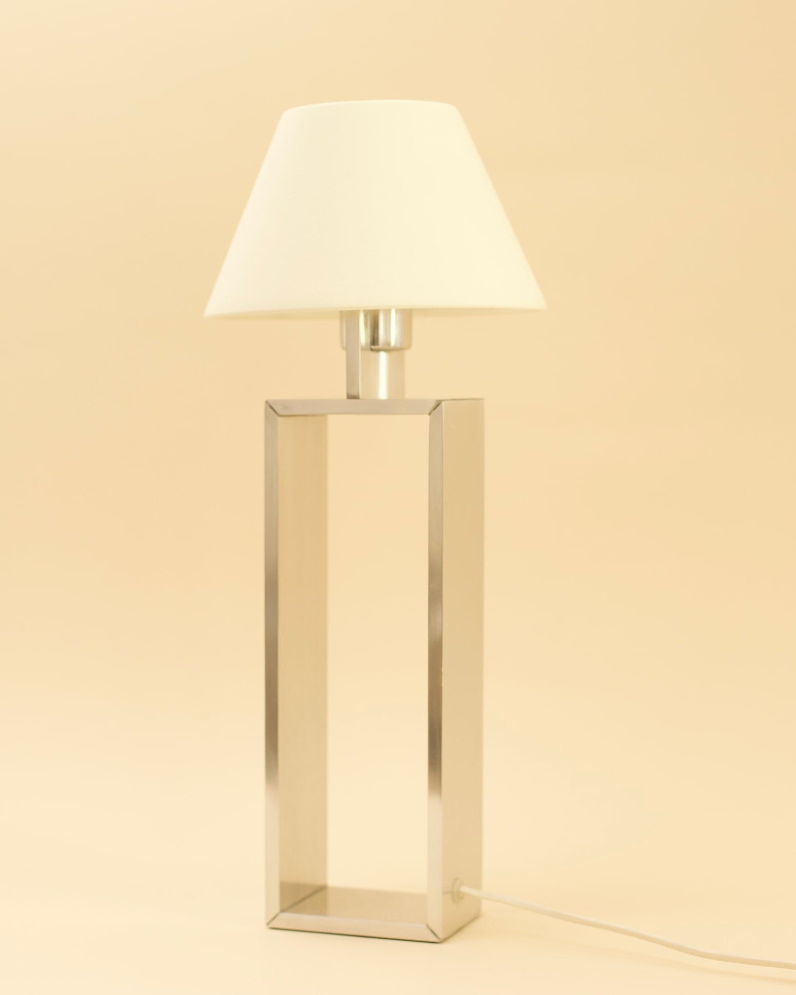 BREUER Table Lamp — side angle showing polished metal base and white shade