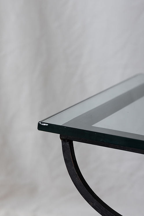 Curved Iron & Glass Coffee Table — lifestyle setting