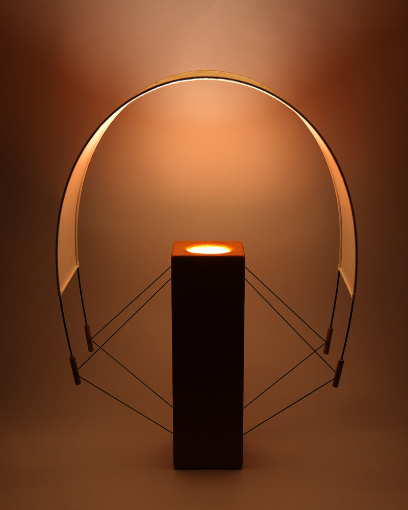 Lumia terracotta table lamp with geometric brass frame detail
