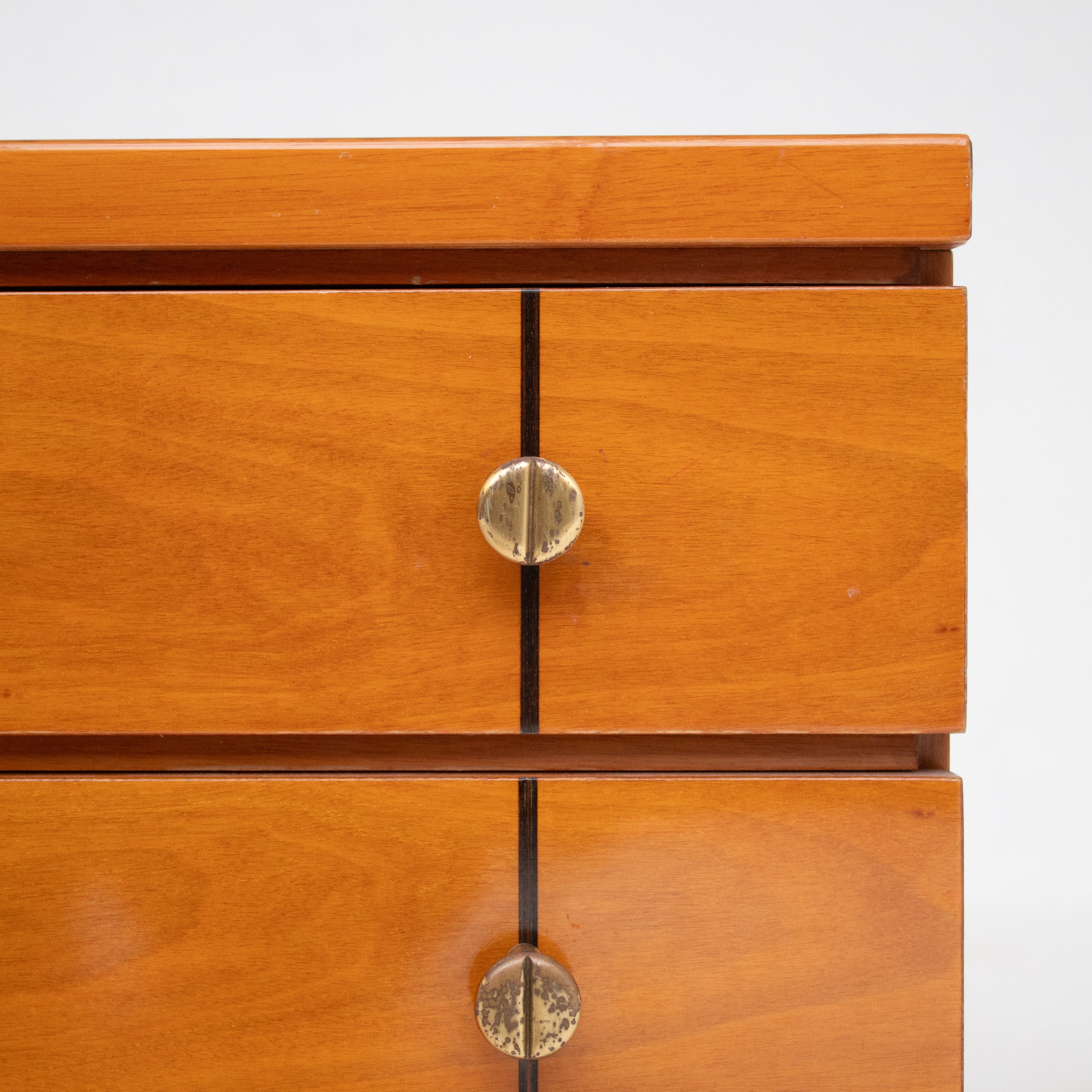 Set of Mid Century Nightstands in Wood — close-up of warm wood finish and brass knobs