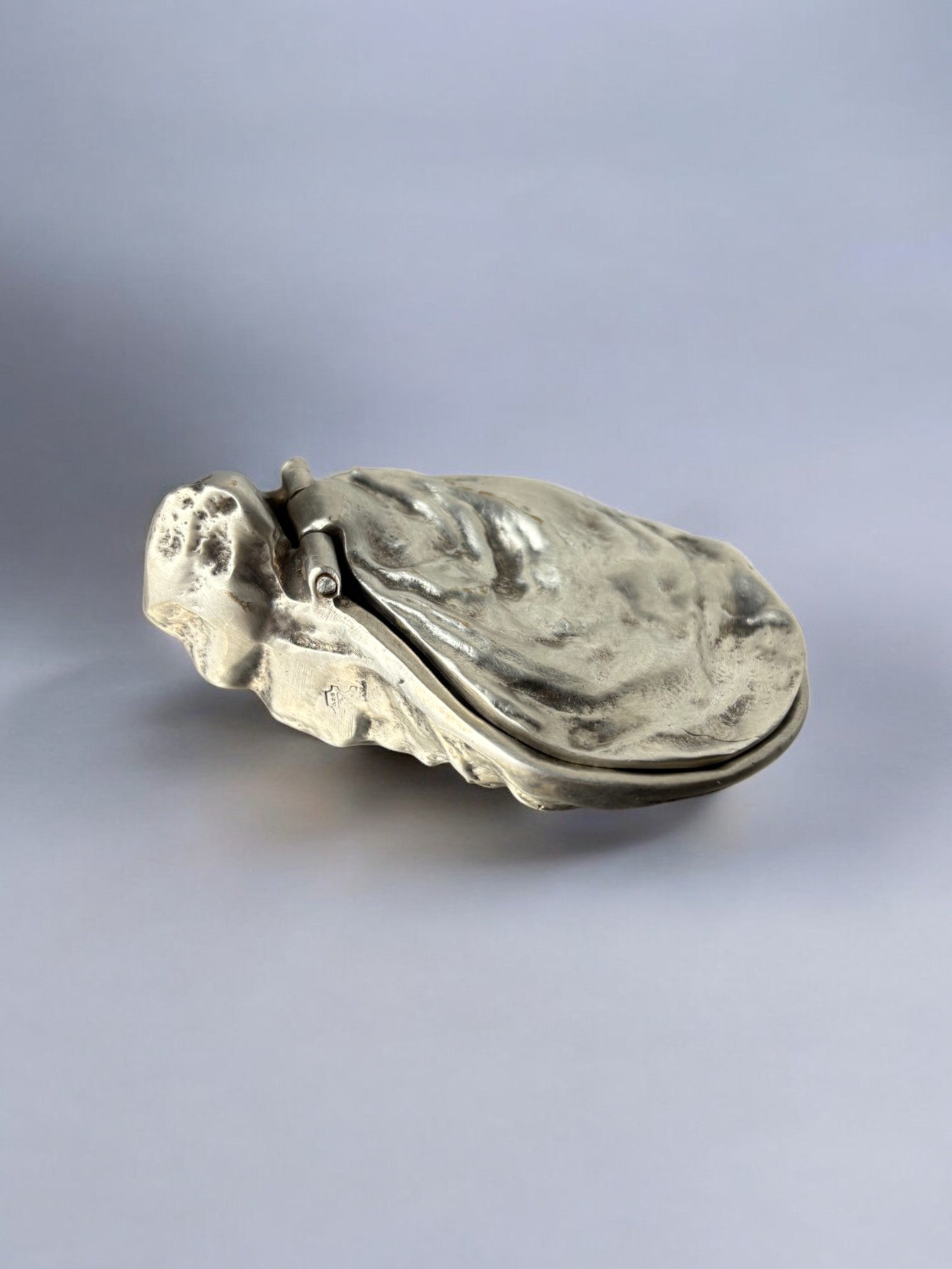 Oyster shell jewelry box in silver, Italy, 1960's — side angle showing textured surface