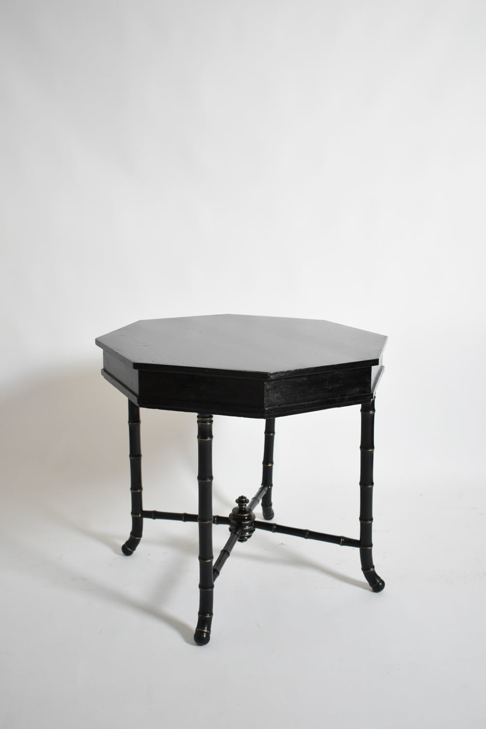 Faux Bamboo Octogonal Table, 1910s — angled view highlighting black finish and bamboo legs