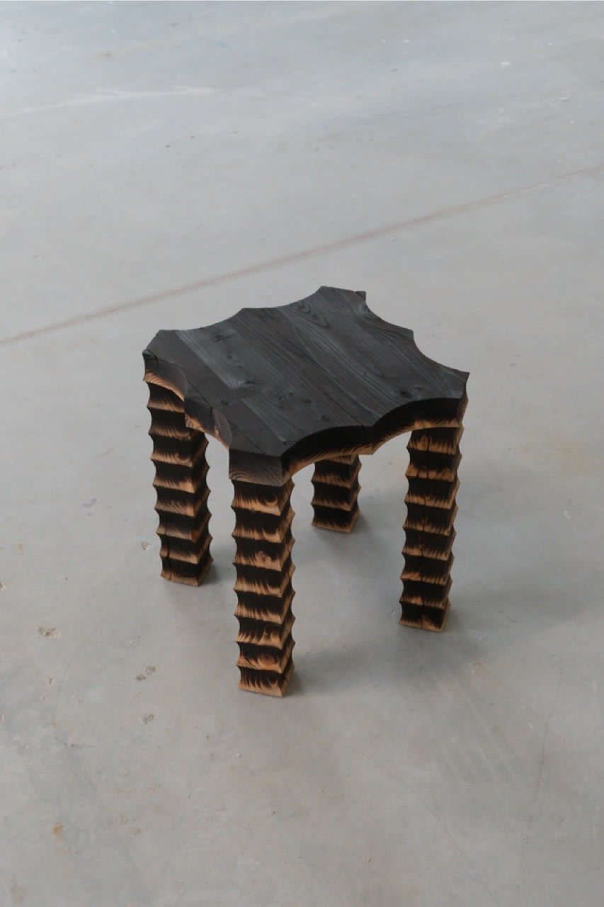 The Spiky Stool — back view highlighting textured wooden legs
