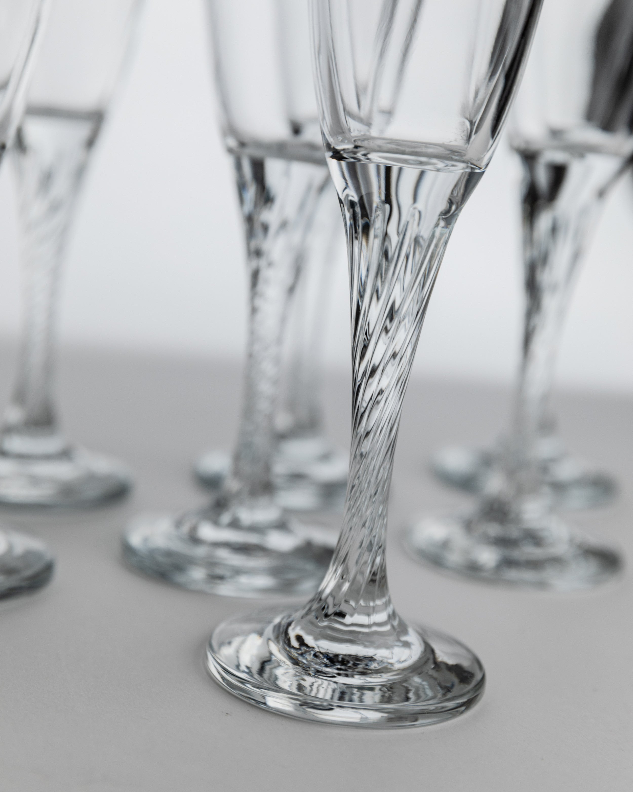 Close-up of twisted crystal stem detail on 1980s champagne flute