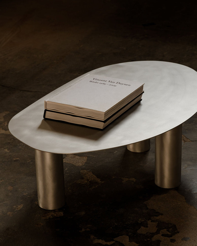 Coffee Table object115 — close-up of brushed metal surface with book