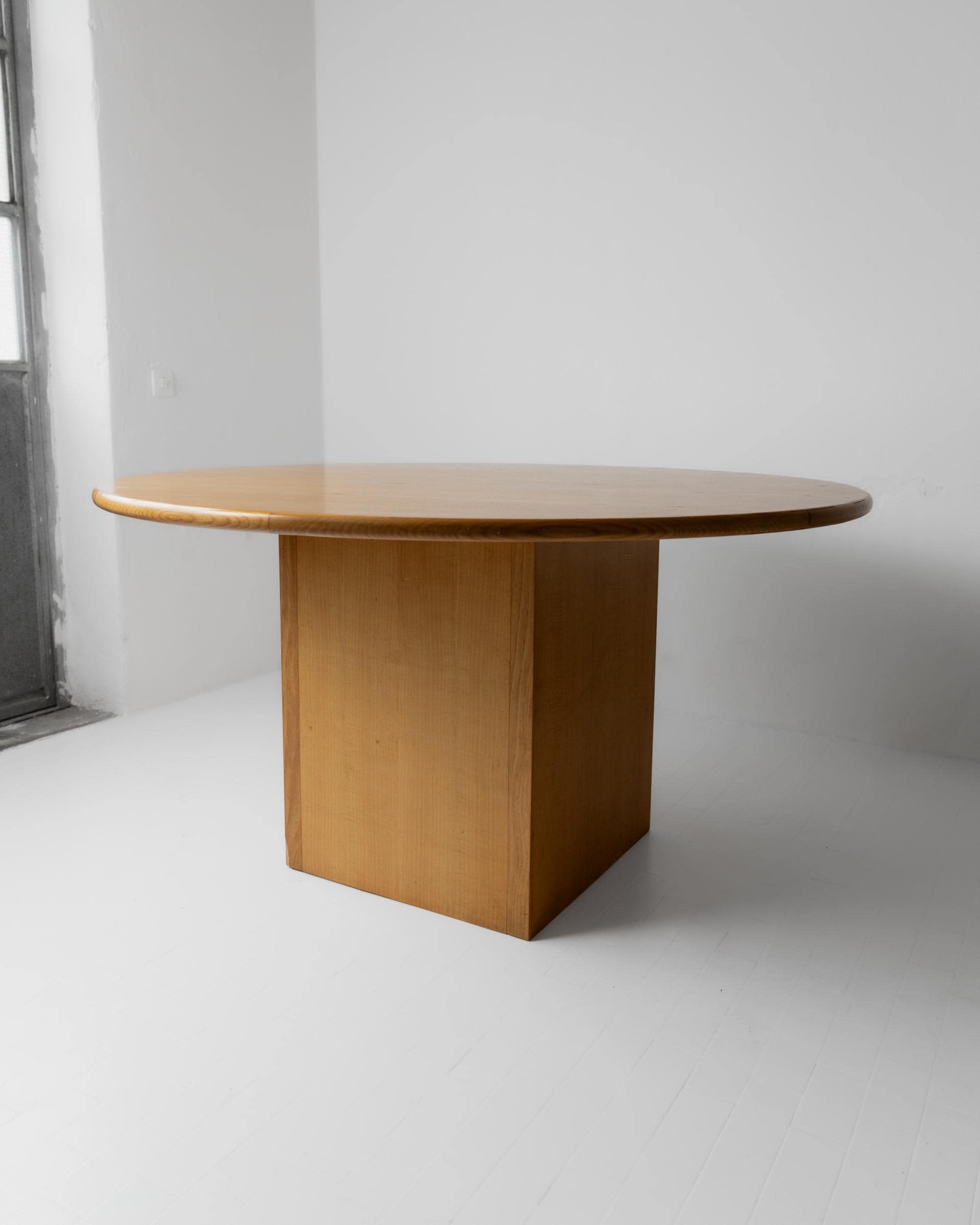 1980s Large Round Wooden Table — angled view in minimalist setting