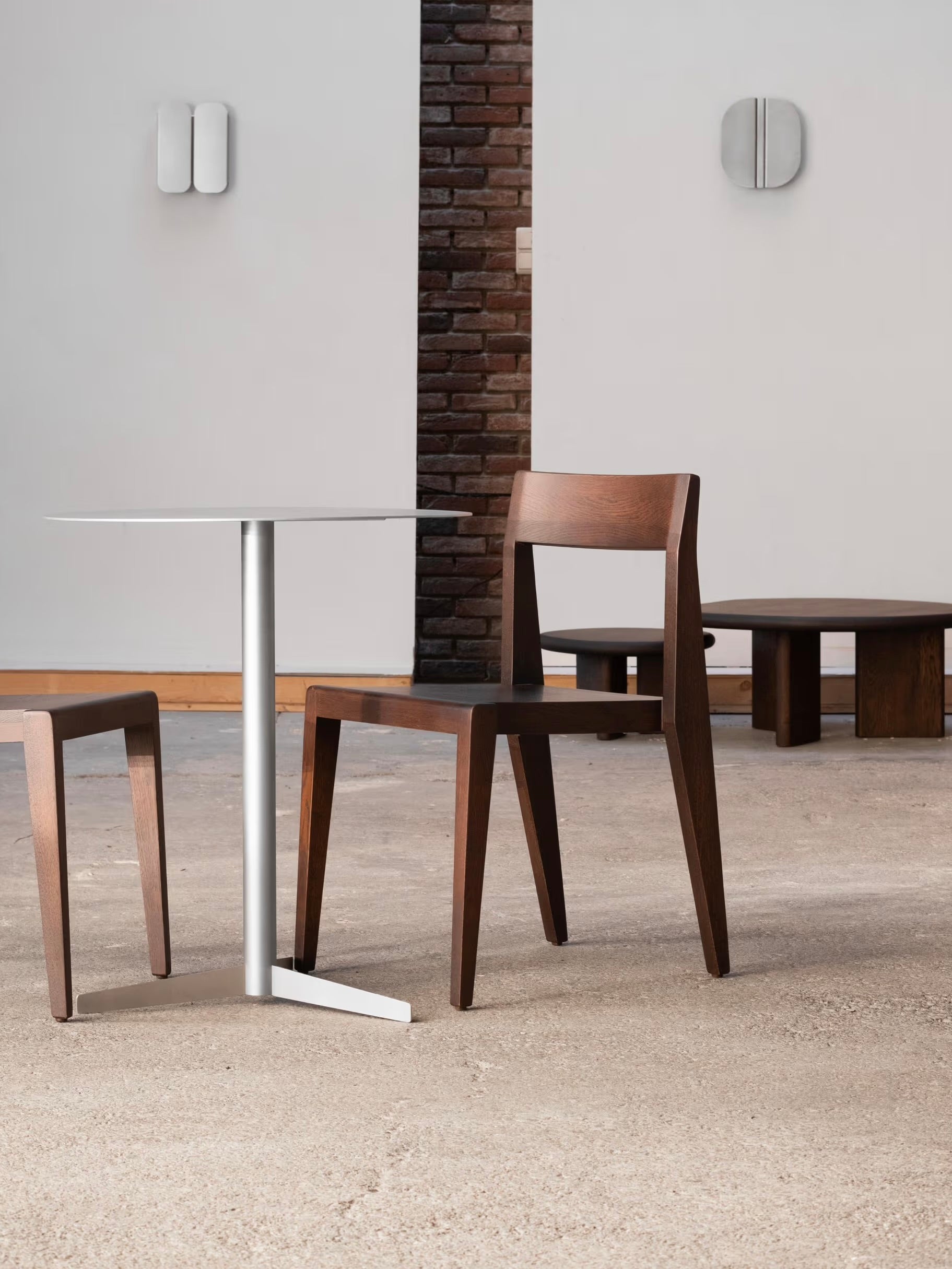 Chair - Ed. Espresso - Oak — angled view beside modern table