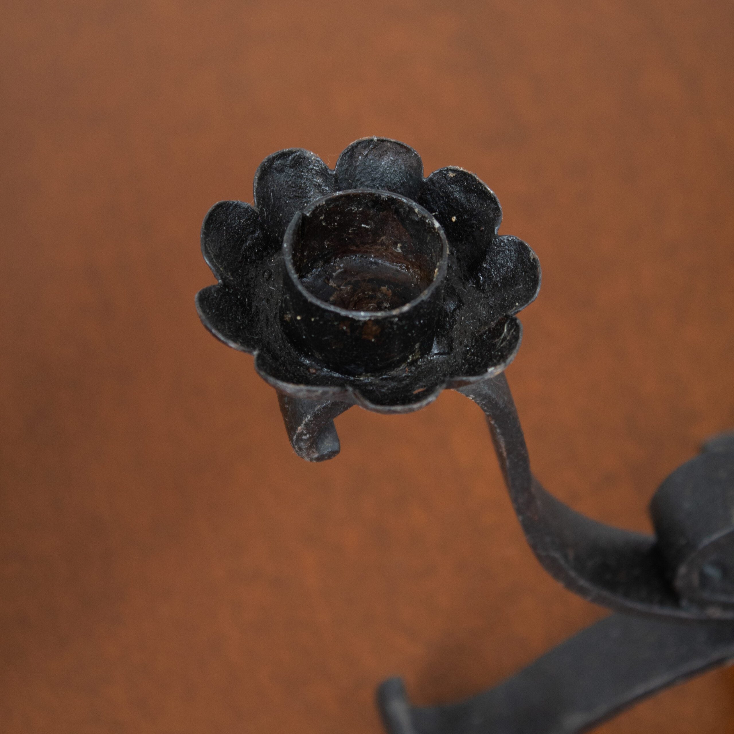 Pair of Brutalist Iron Candleholders with Sculptural Scroll Arms — detail view