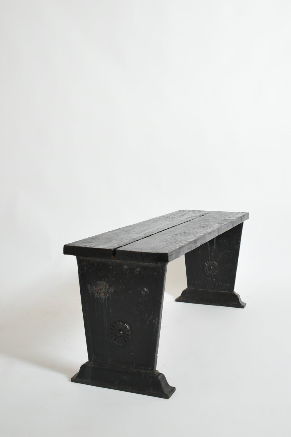 Skoglund & Olson Cast Iron Bench, 1920s — angled view of black cast iron legs