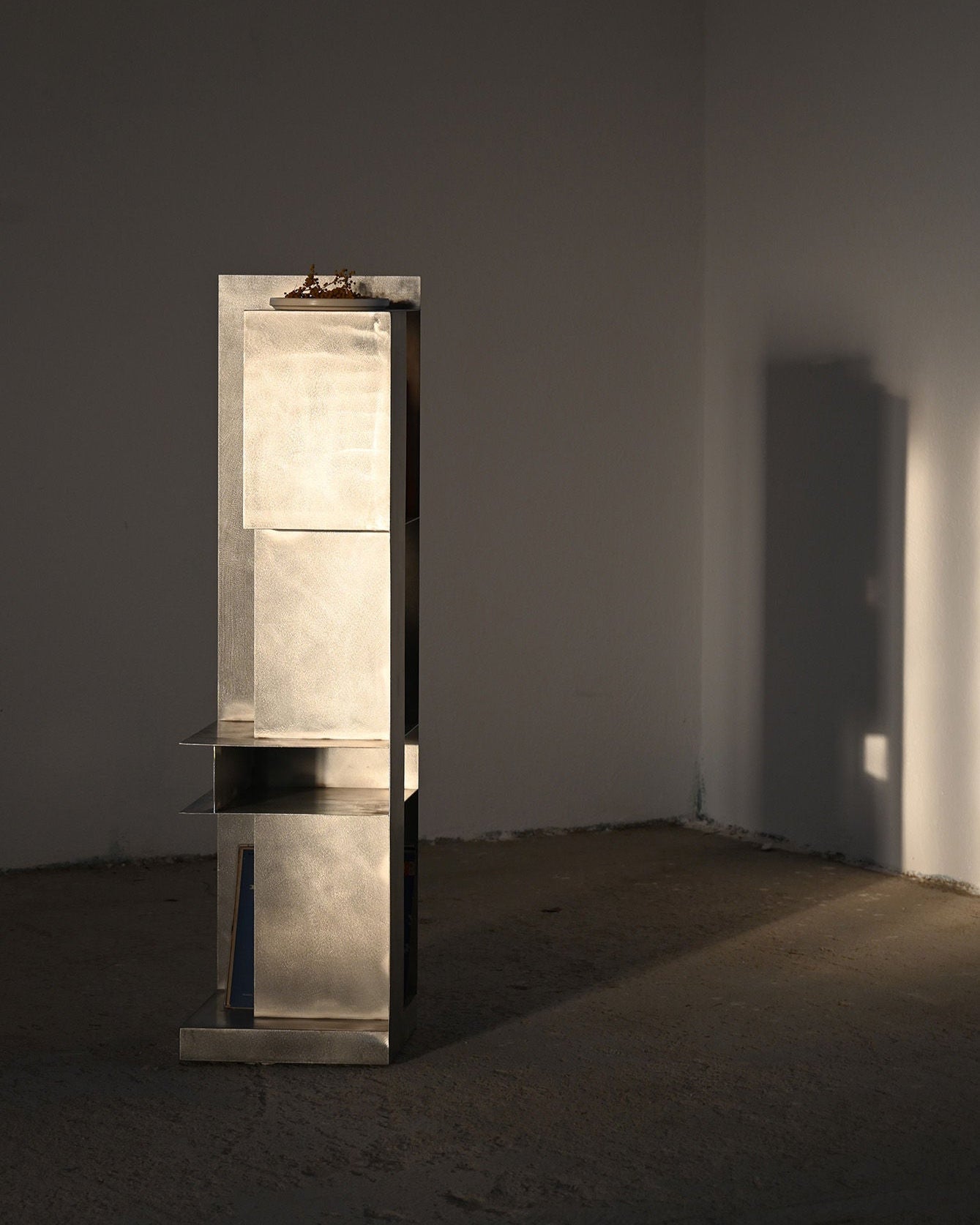 ZEN' Standing Shelf — close-up of brushed metal surface in minimalist setting