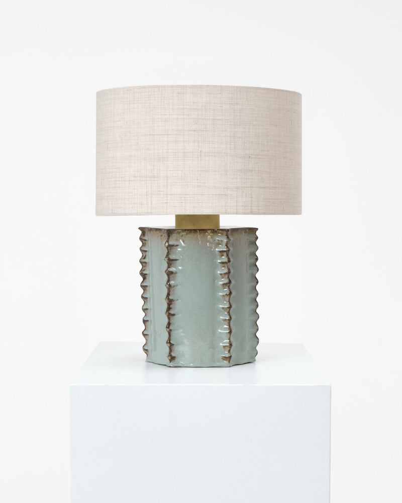 Totem Table Light — close-up of textured ceramic base with linen shade