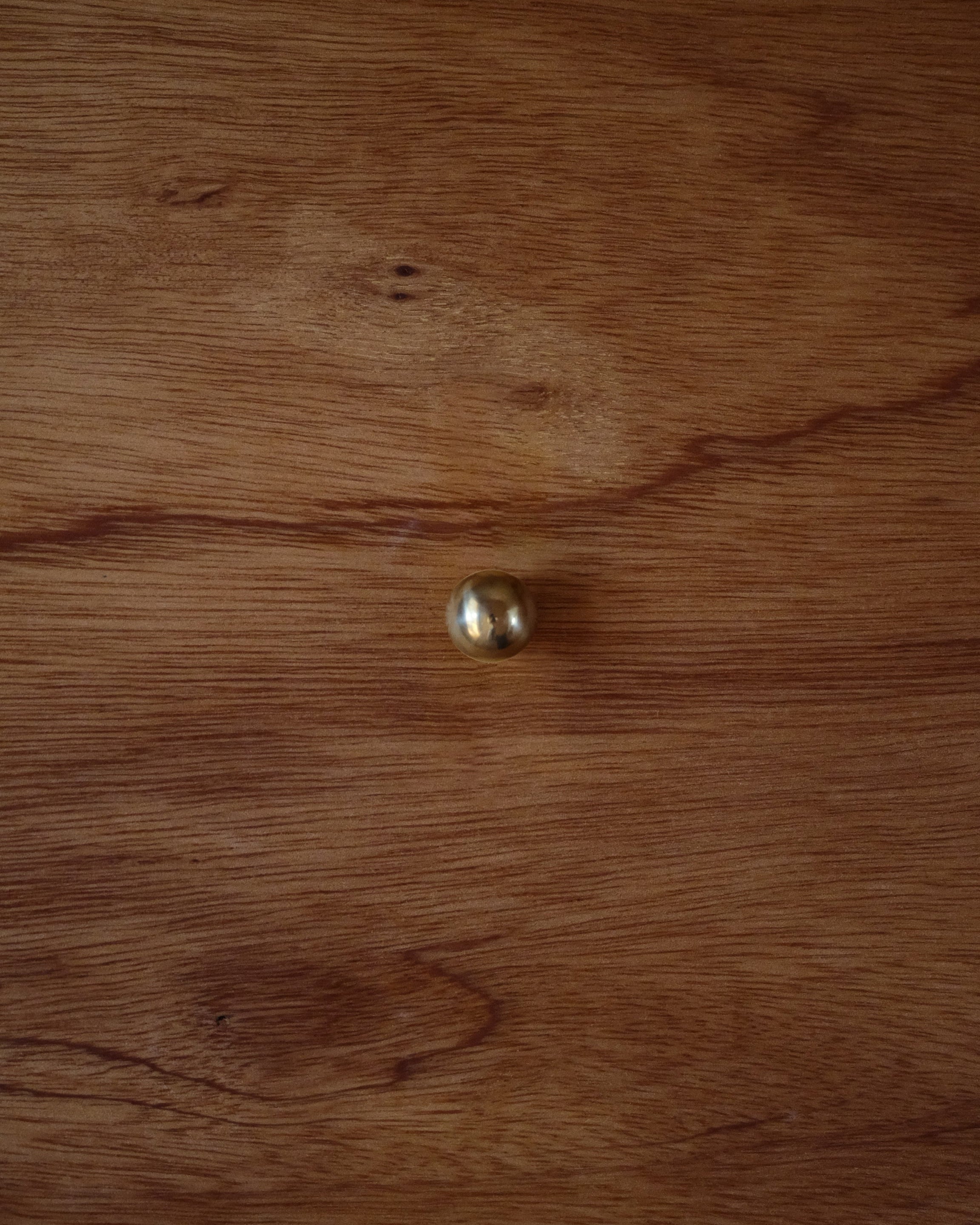 CERCLE Cabinet Knob Small — back view on wooden surface
