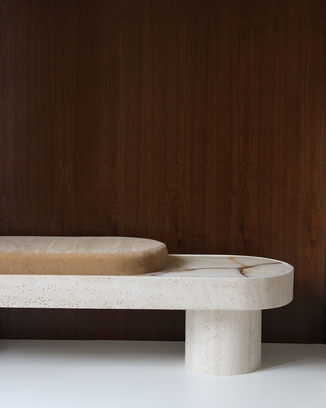 Noto Bench — back view showing light-colored stone and rounded seat