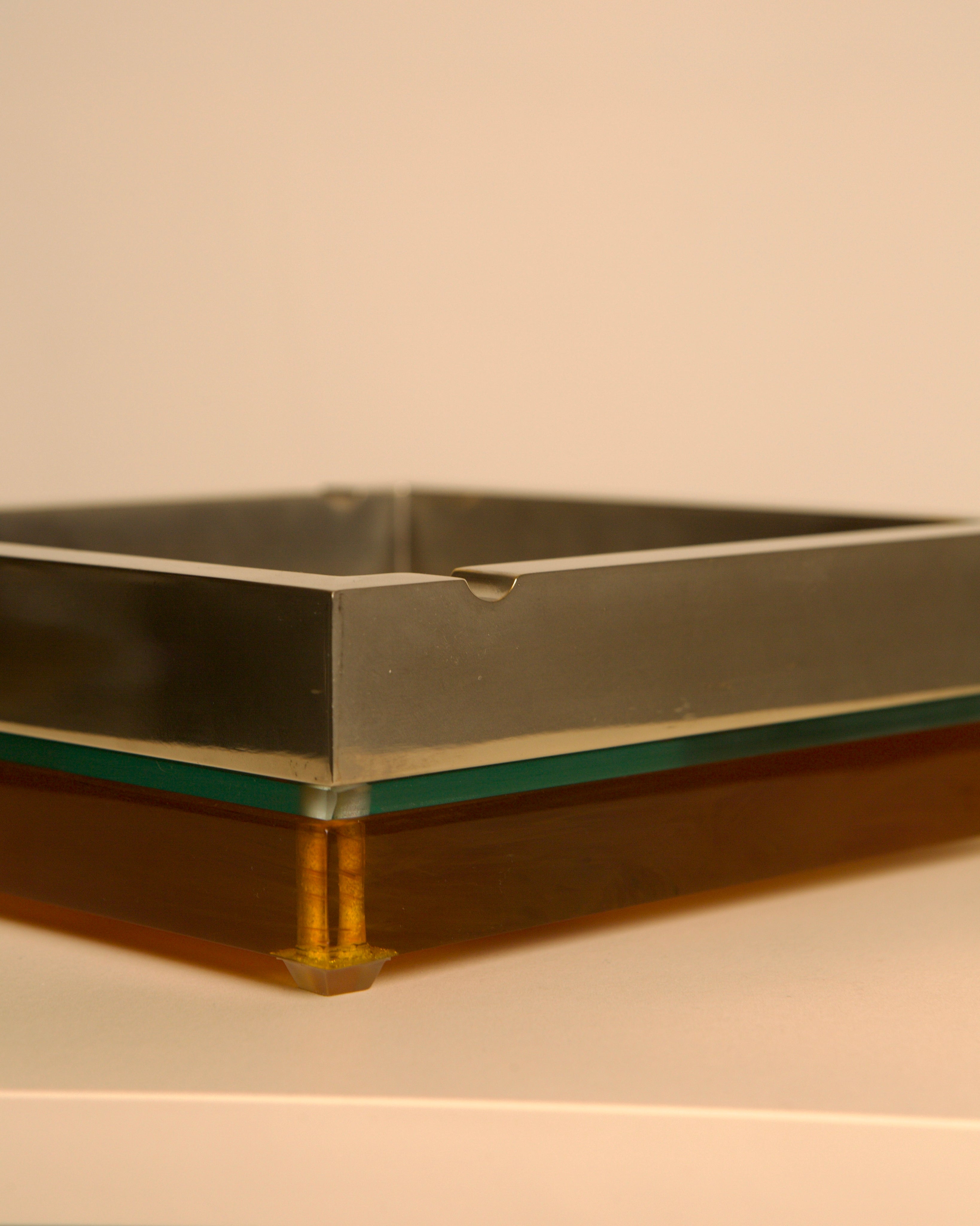 Large 70s Italian square ashtray in metal, glass and light smoked Plexiglas — close-up