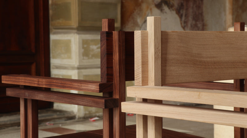 Stack chair with armrests — close-up of wooden frame details