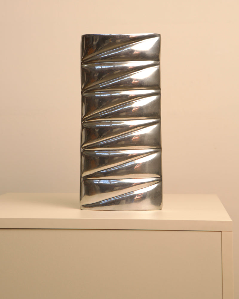 Vintage cast aluminum spiral vase with reflective metallic finish