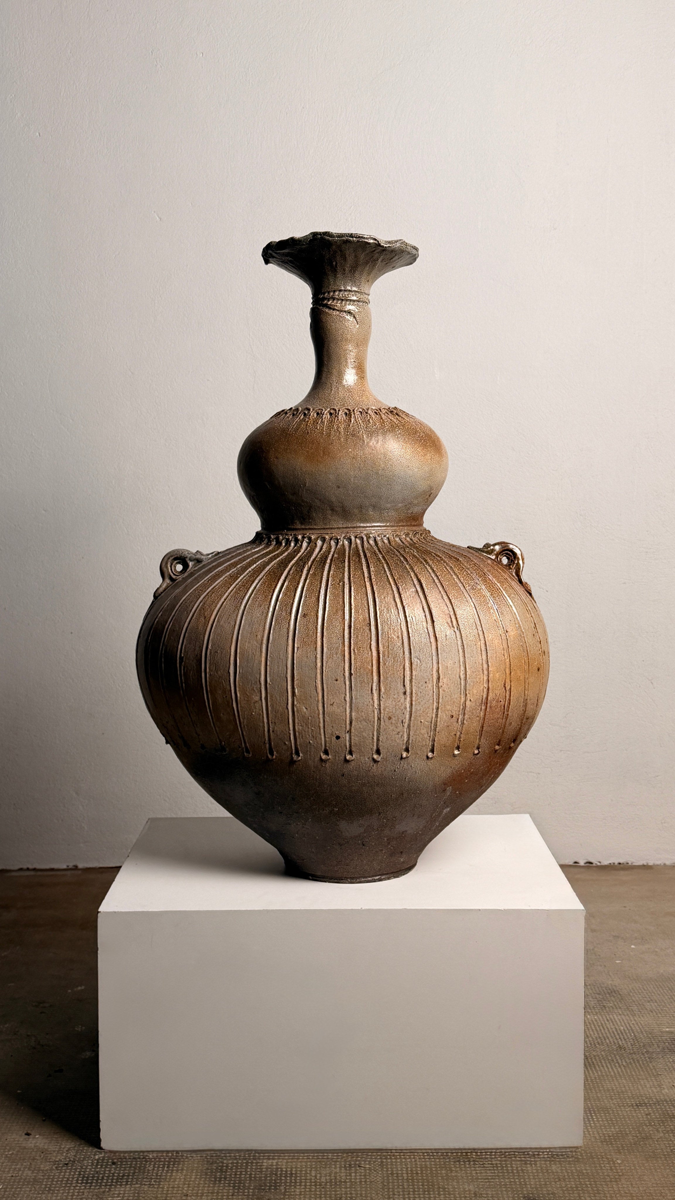 Monumental handled vase by Gustave Tiffoche — front view highlighting textured ceramic surface