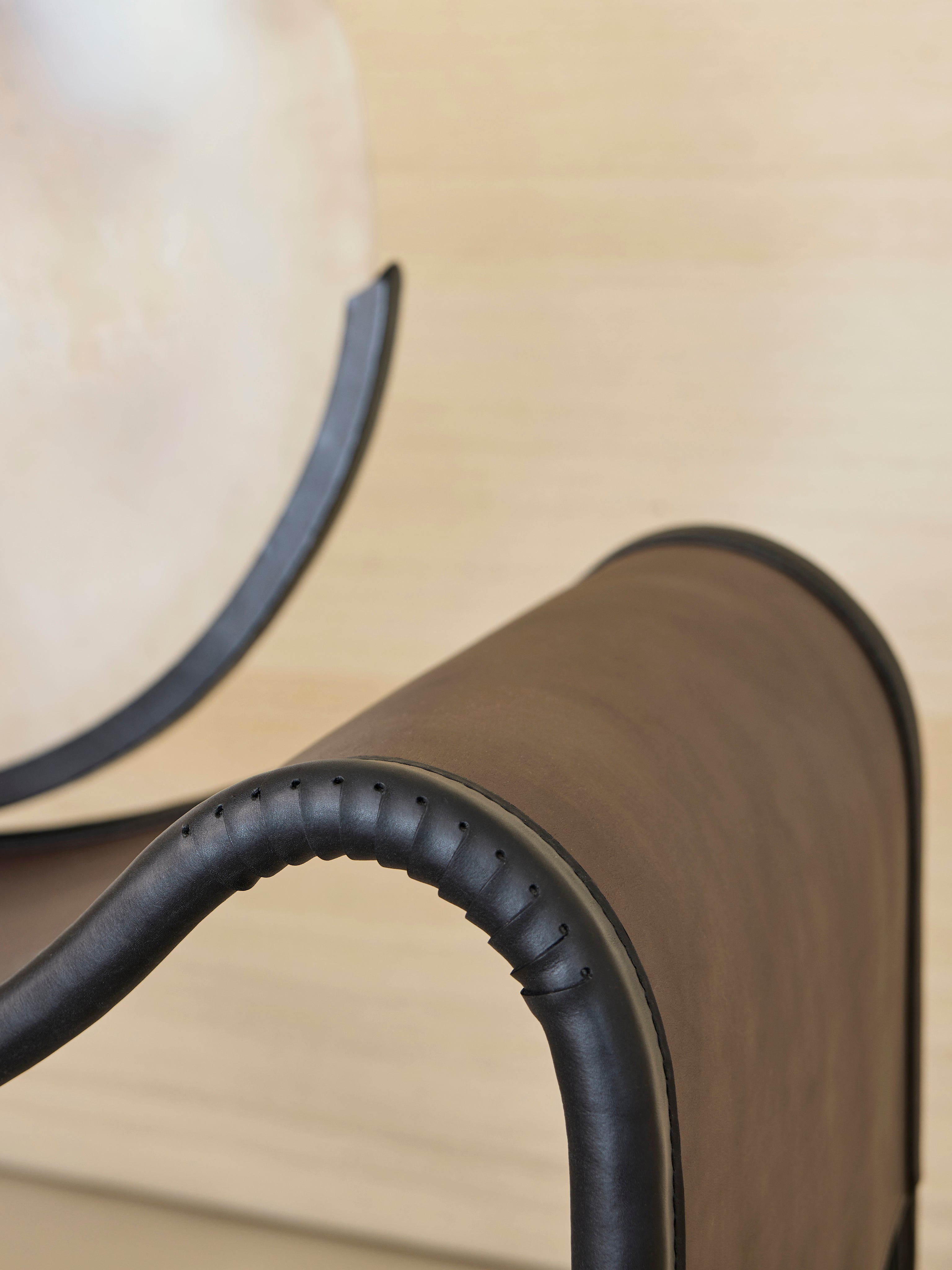 MOON Armchair in Metal and Glass — close-up of leather armrest detail