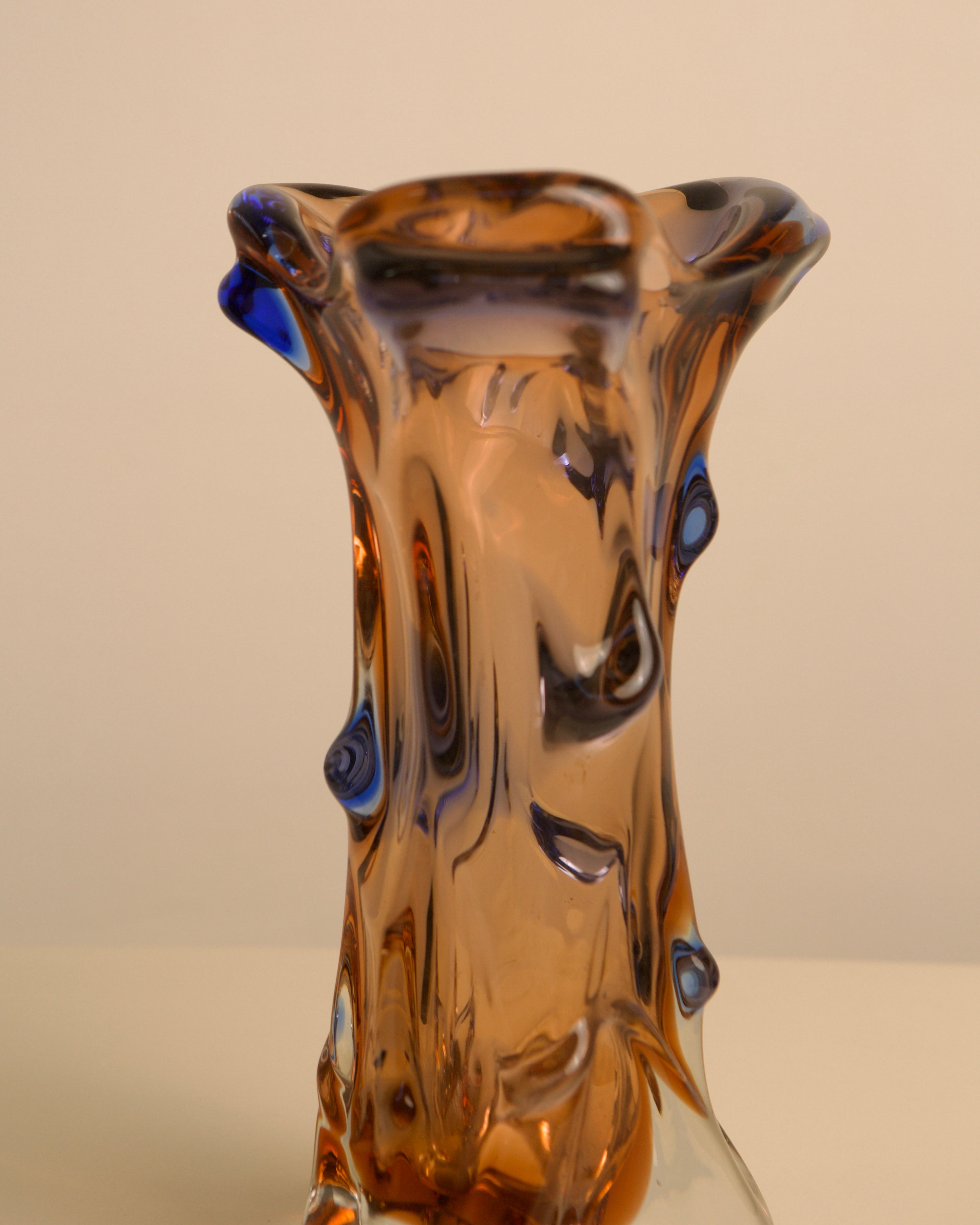 Amber Murano glass vase with blue accent details, organic form