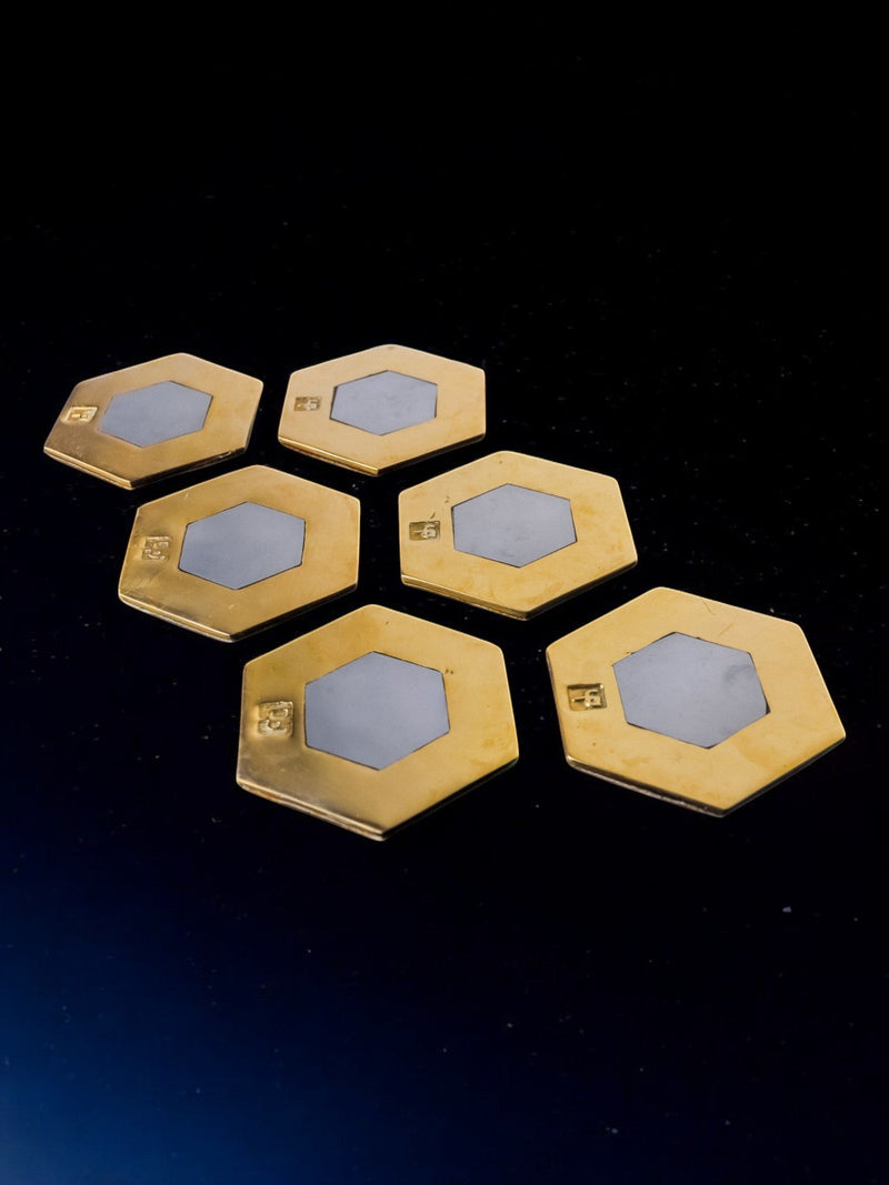 Set of 6 Brutalist Coasters by David Marshall, Spain, 1970s — close-up of hexagonal brass coasters with white insets