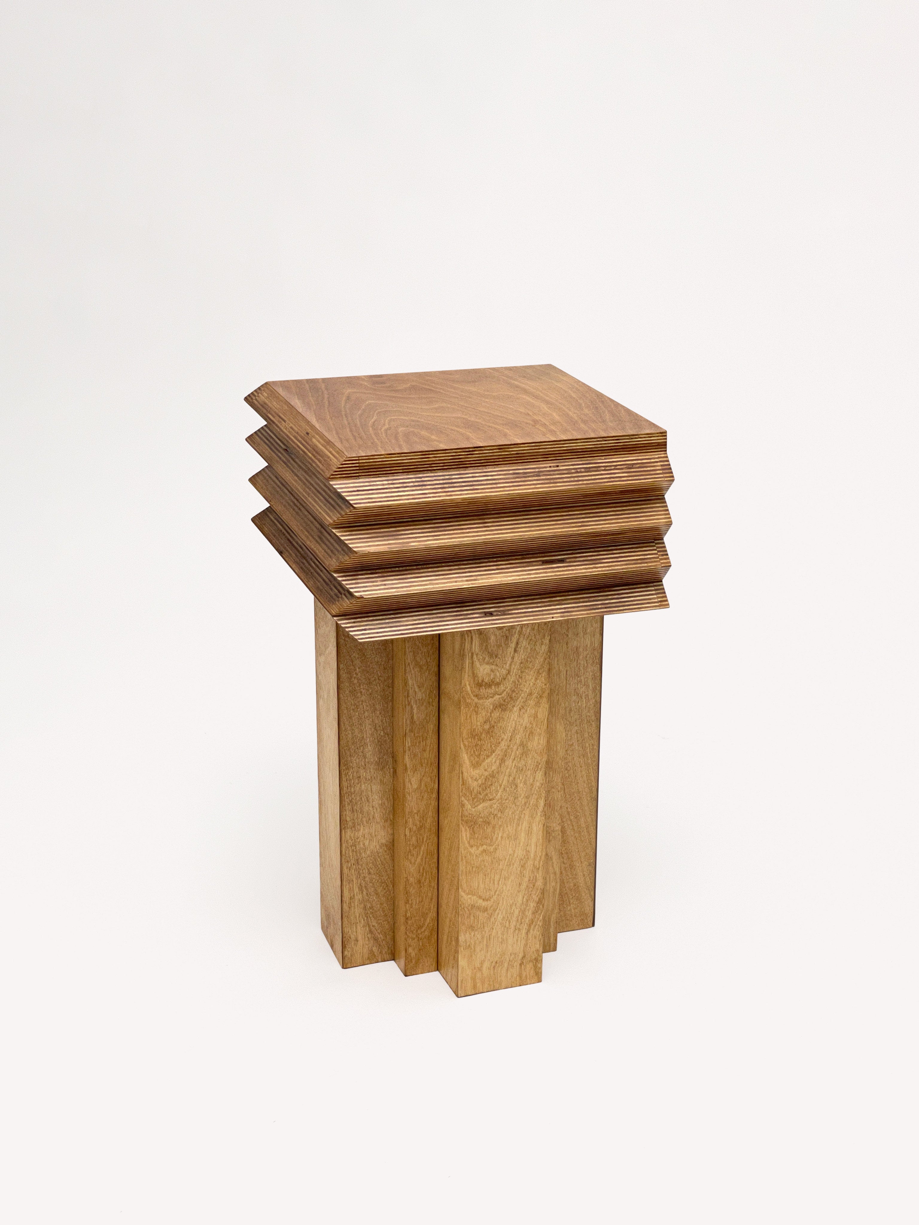 The MM Stool - Butterscotch by Goons is a modern wooden side table with a square top and four beveled layers on a geometric base, crafted by GOONS—ideal for customizable furniture collections.