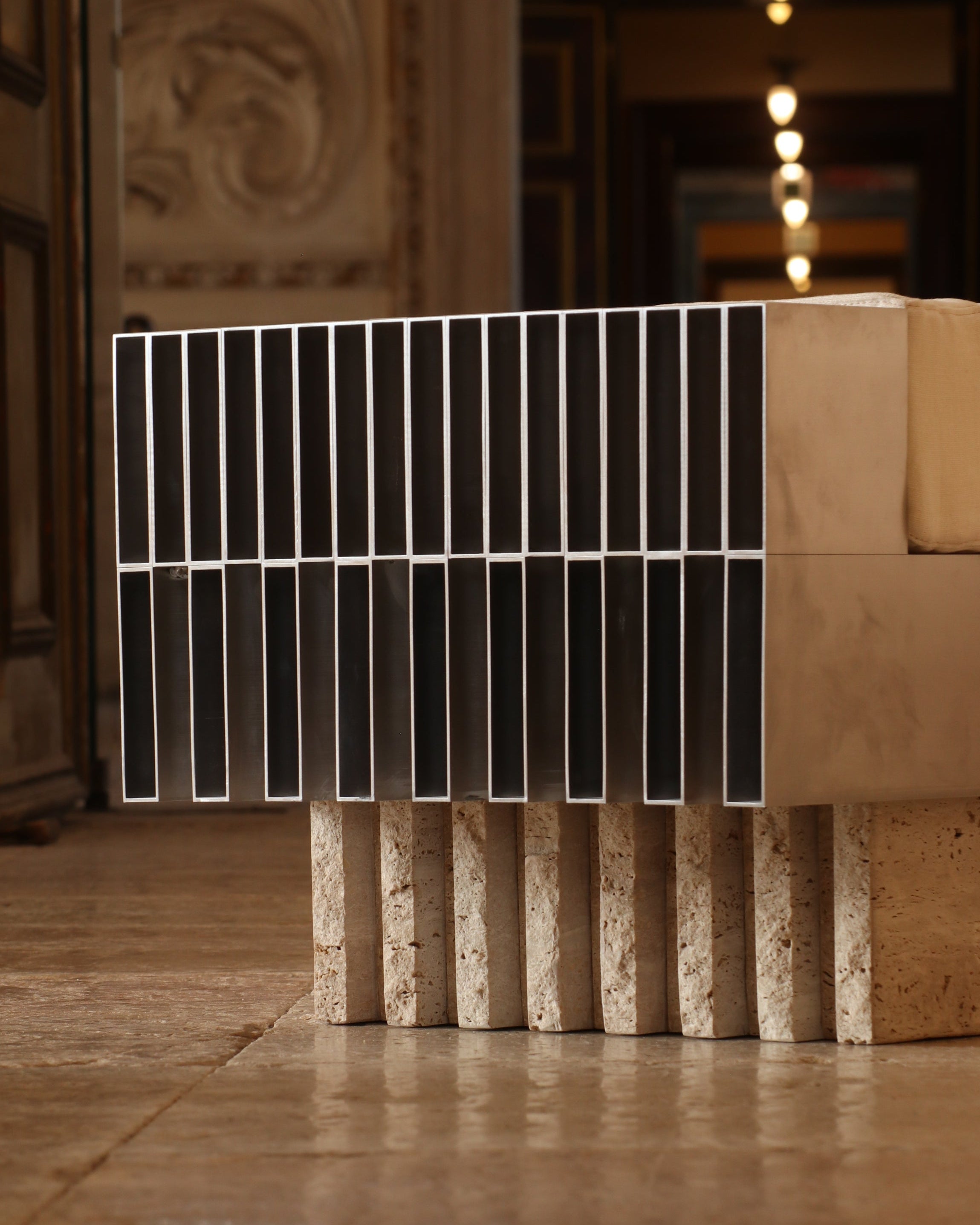 Piano ottoman with white metal bars and travertine base by Filippo Andrighetto