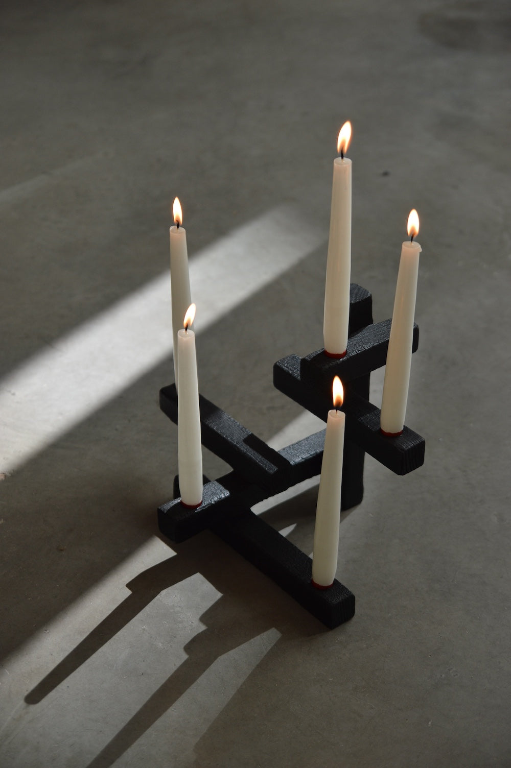 TETRIS 5 — top view of black candle holder with white candles
