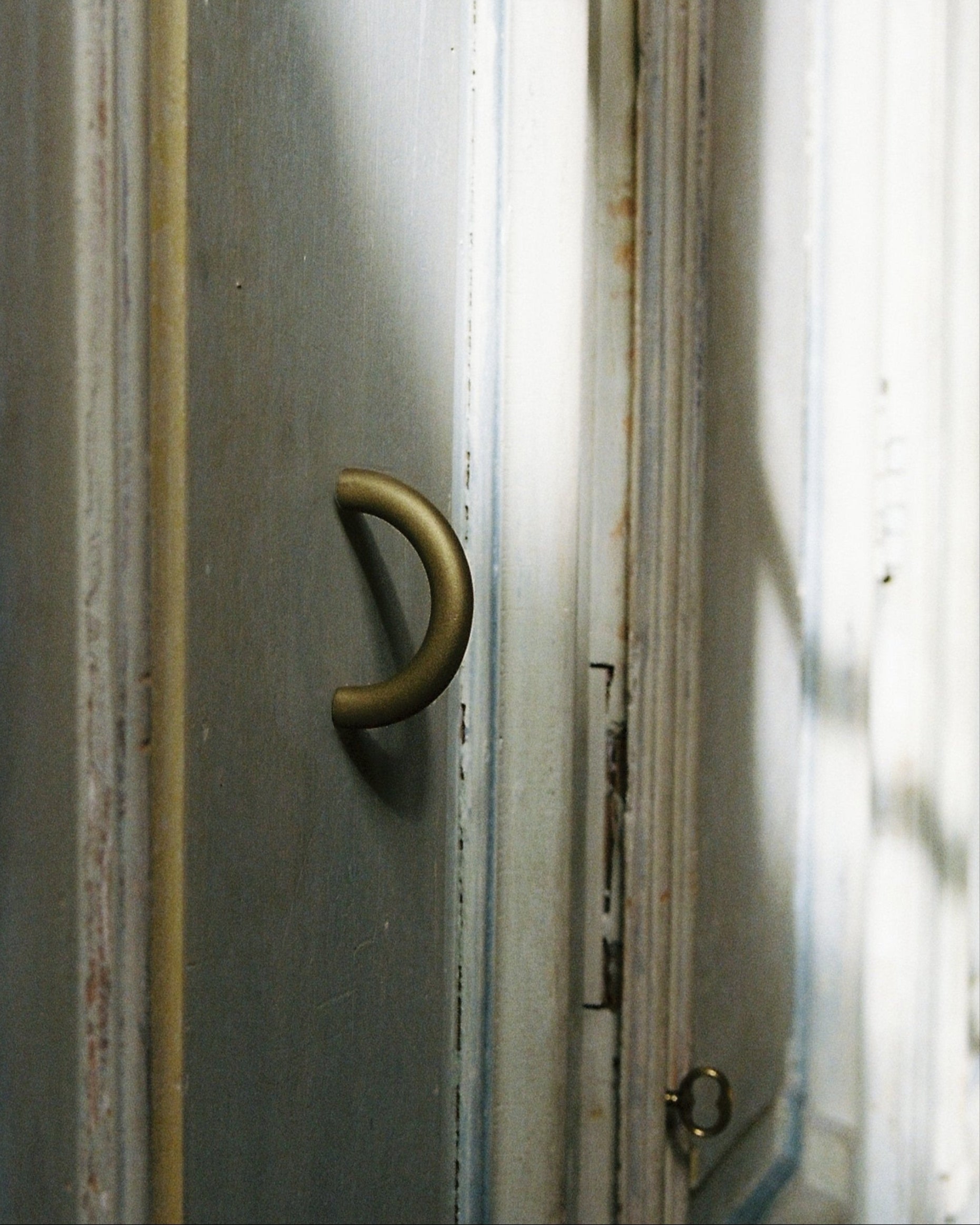 CERCLE Cabinet Pull Thin (2 sizes) — close-up of matte brass handle on cabinet